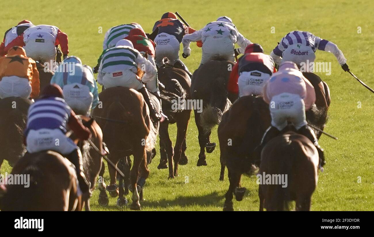 Sean Flanagan riding Jeff Kidder (centre, blue/orange) clear the last to win The Boodles Juvenile Handicap Hurdle during day one of the Cheltenham Festival at Cheltenham Racecourse. Picture date: Tuesday March 16, 2021. Stock Photo