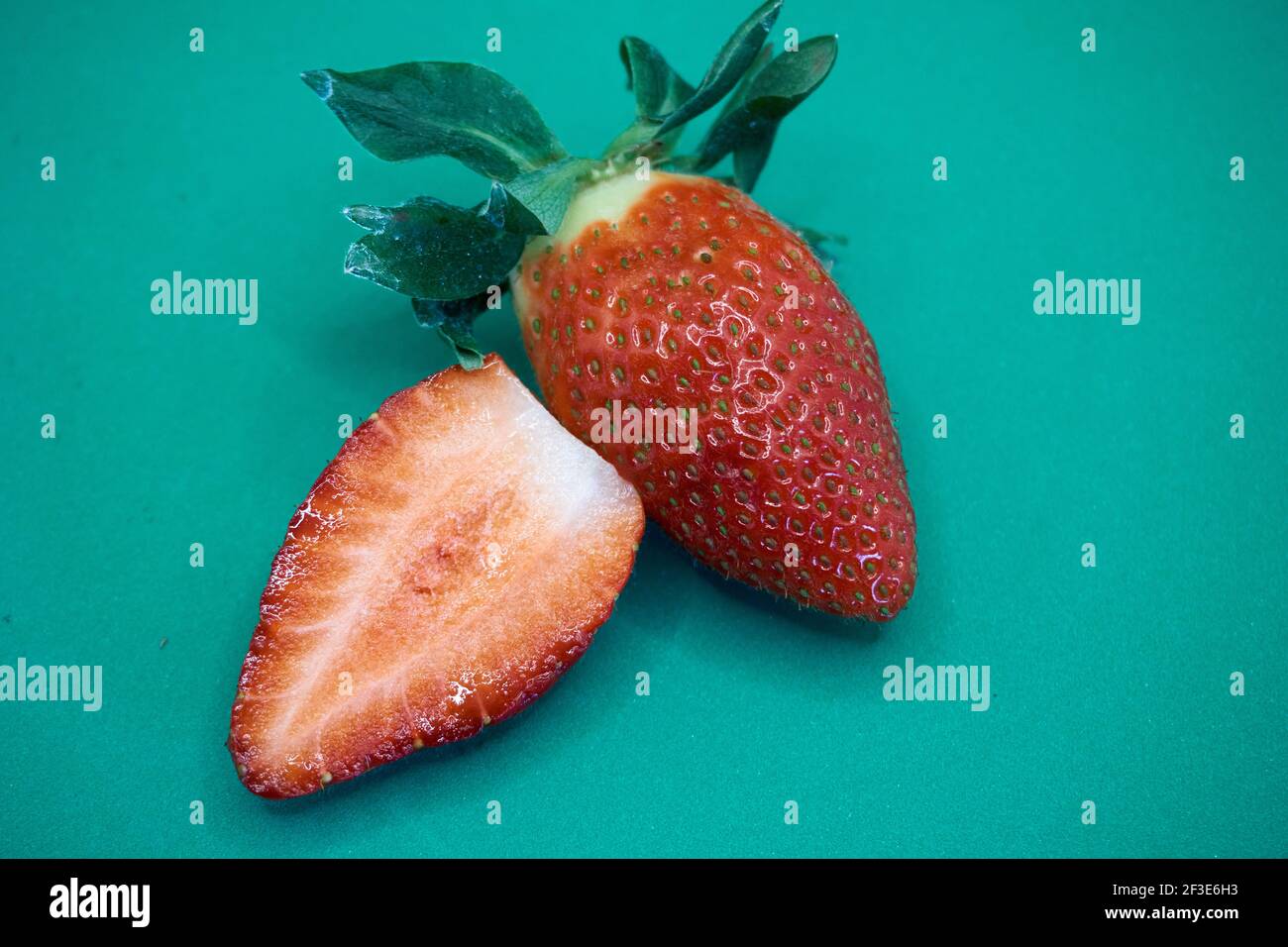 Ripe strawberry cut in half hi-res stock photography and images - Alamy