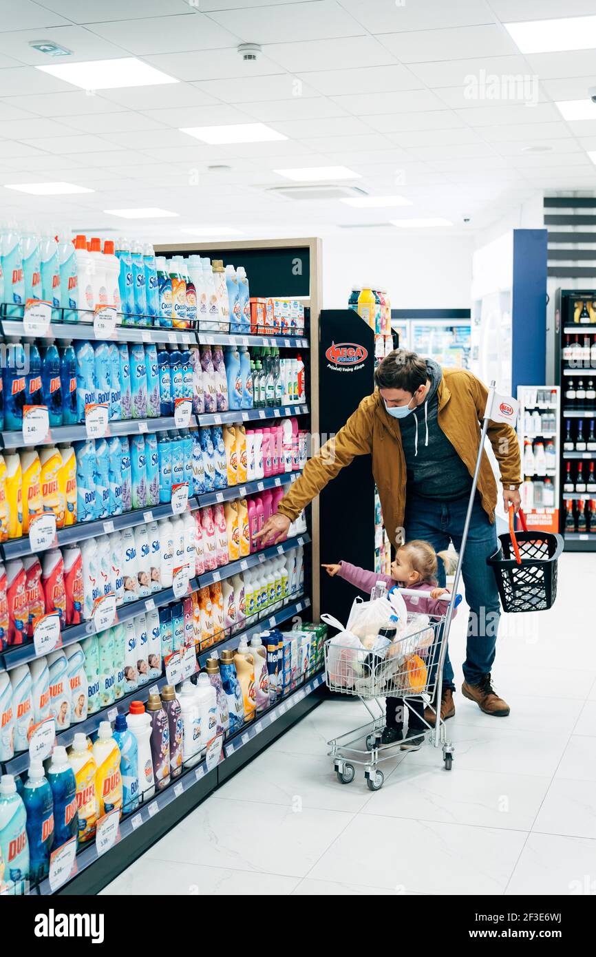 Budva, Montenegro - 17 march 2021: A child with a small trolley in the  supermarket, go shopping with his mother. The family goes shopping Stock  Photo - Alamy