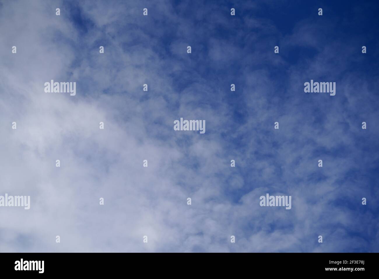 A low angle shot blue sky and white clouds Stock Photo - Alamy