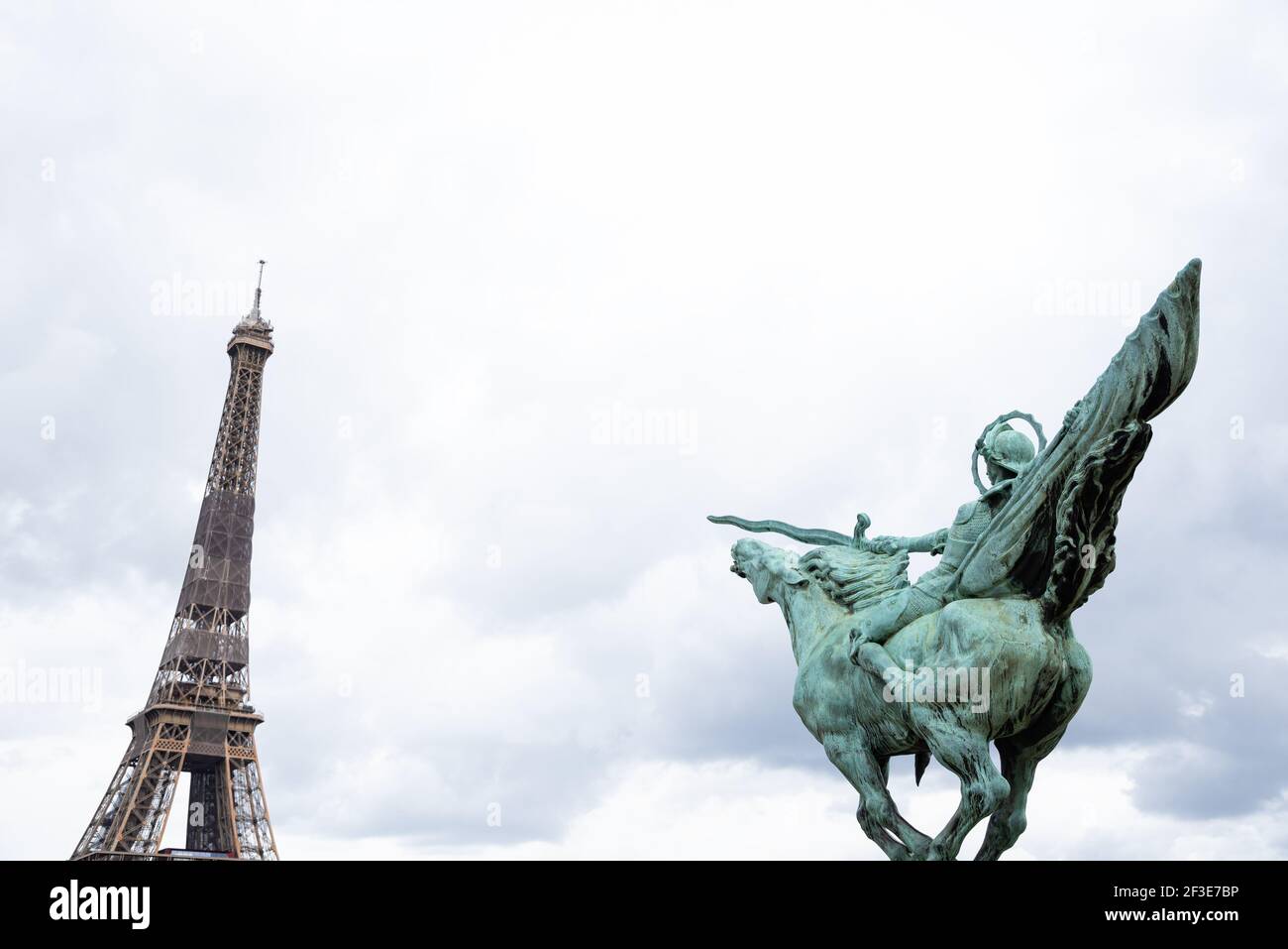 Bandaged Eiffel Tower and La France renaissante rider statue on the Pont de Bir-Hakeim bridge. Paris, France. Fight. Abstract. Stock Photo