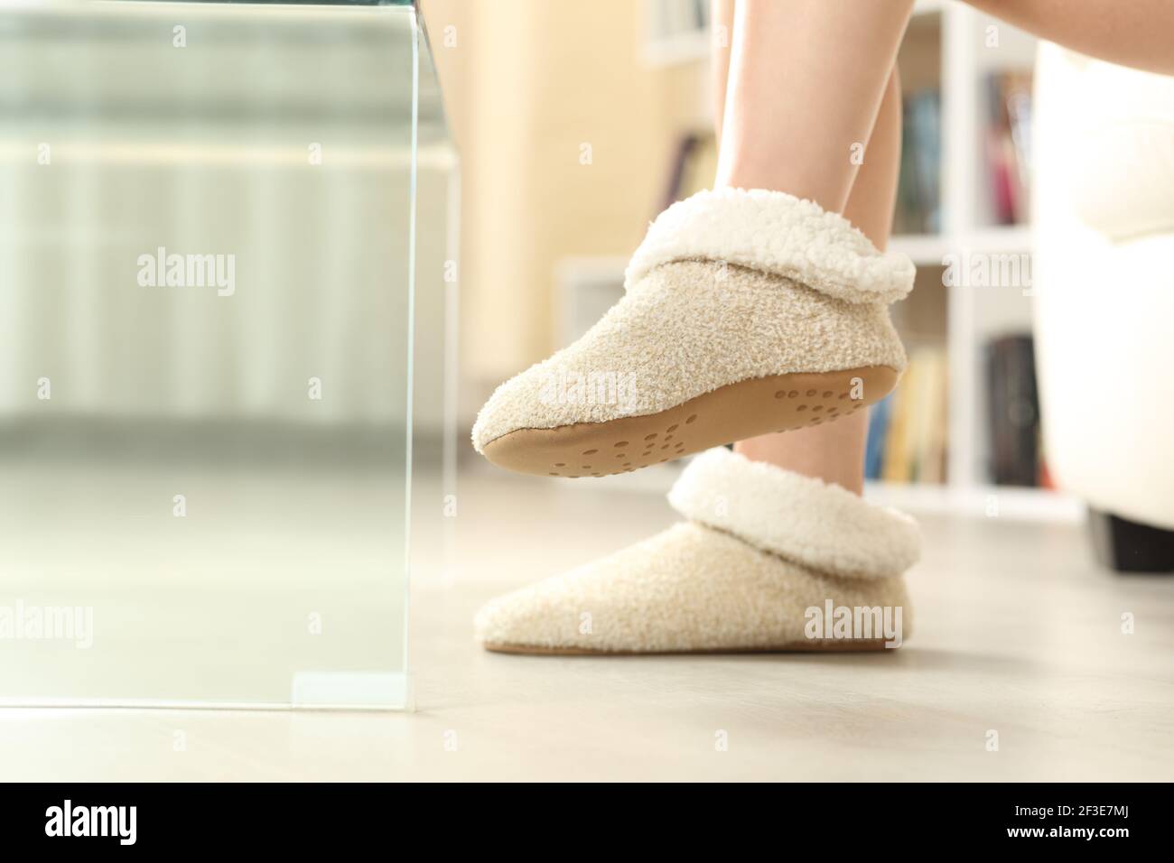 Close up of a woman feet wearing slippers at home Stock Photo