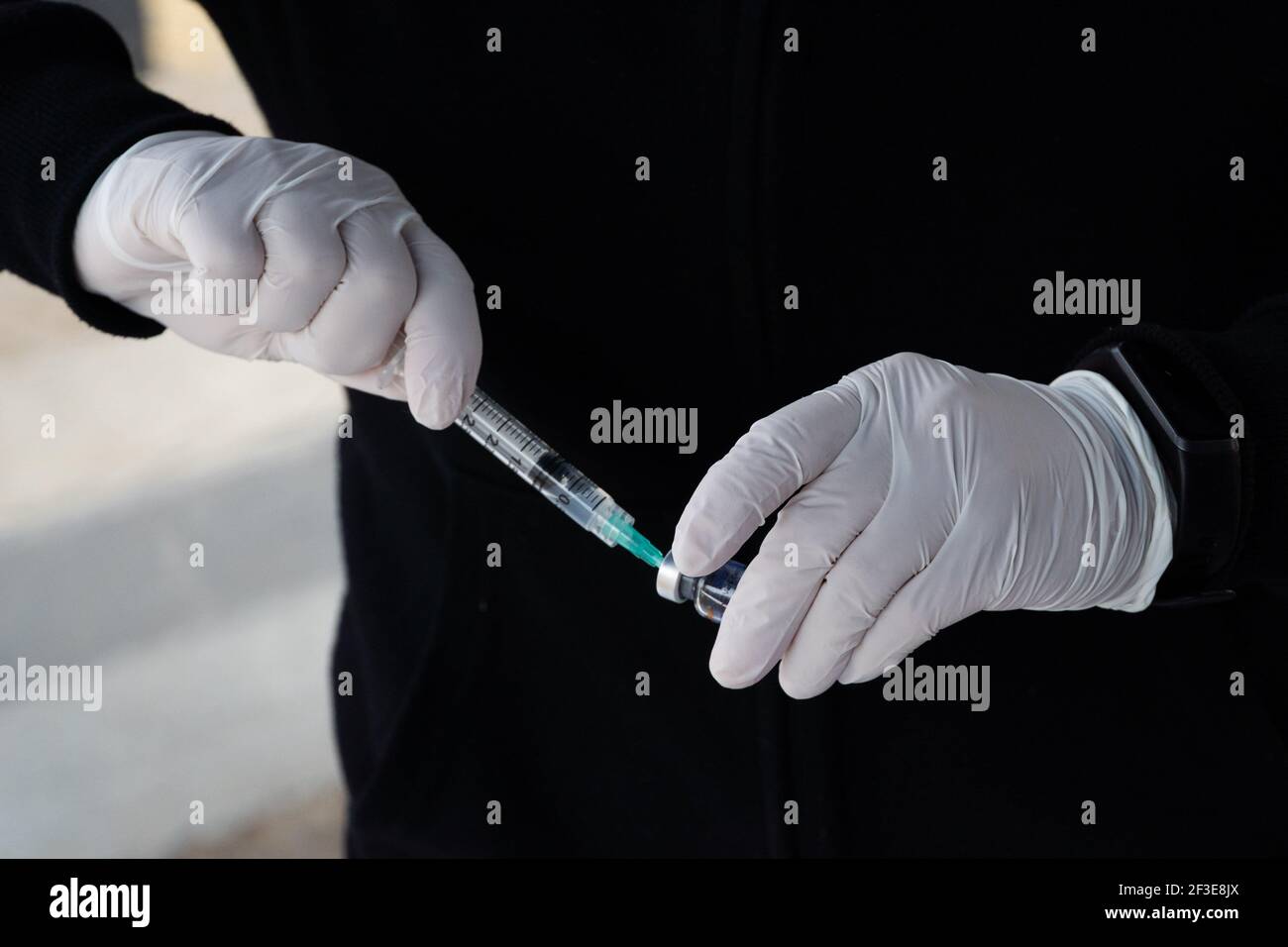 Santiago, Metropolitana, Chile. 16th Mar, 2021. A nurse prepares a dose of the Sinovac vaccine for Covid-19. So far, almost 5 million people have been vaccinated in the country, and 41% of them with the second dose. Credit: Matias Basualdo/ZUMA Wire/Alamy Live News Stock Photo