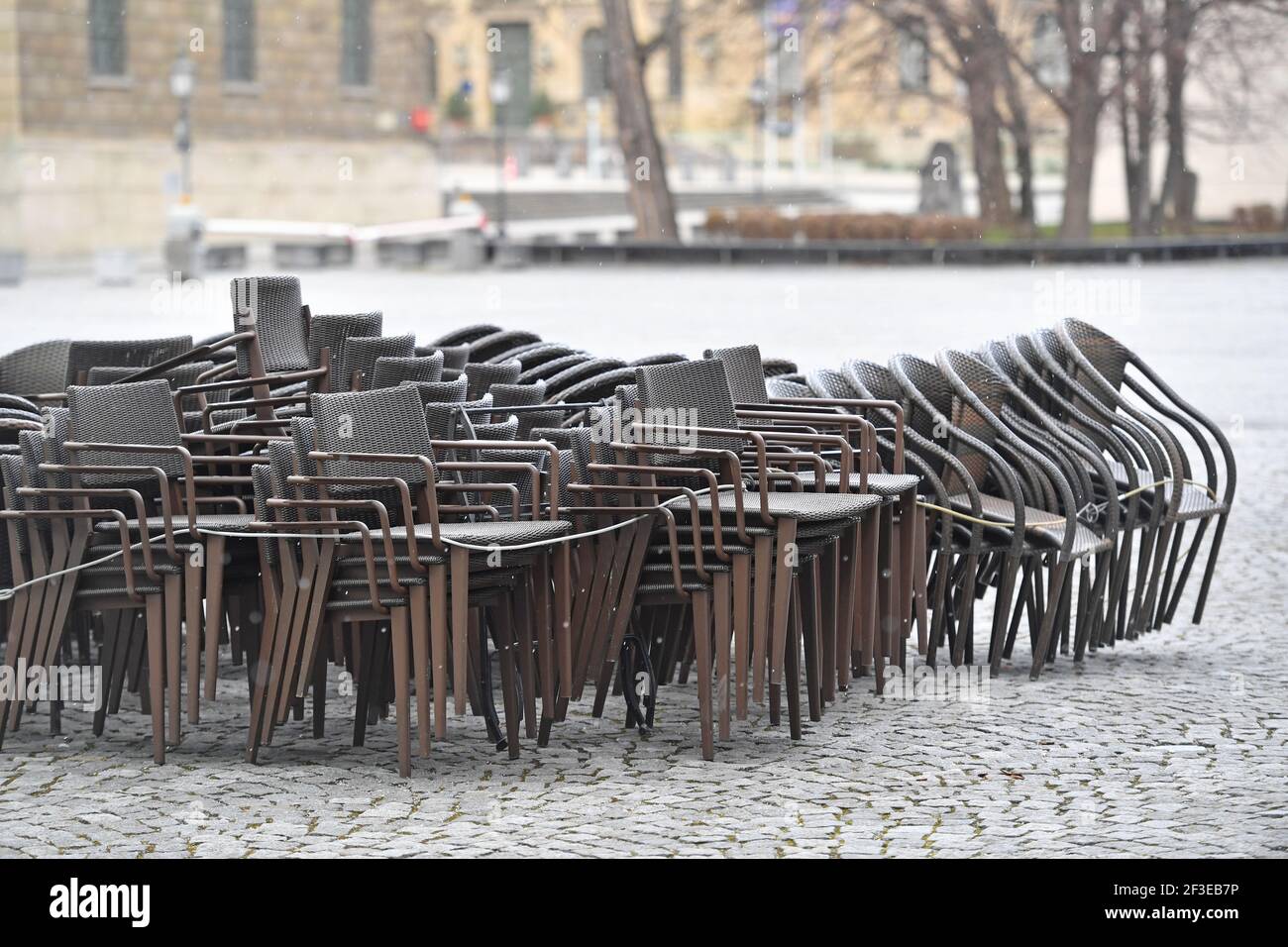 Topic picture: Coronavirus pandemic / consequences for gastronomy: stacked chairs and tables in front of a restaurant, | usage worldwide Stock Photo