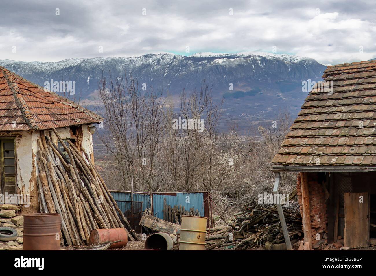 Beautiful view of the mountain Suva Planina (English translation Dry mountain) snow on top from the yard of a country house in Serbia Stock Photo