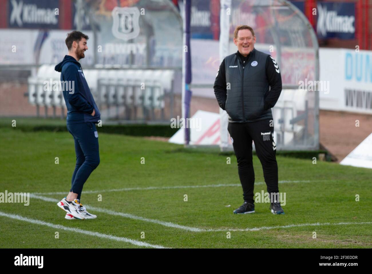Dens Park, Dundee, UK. 16th Mar, 2021. Scottish Championship Football, Dundee FC versus Ayr United; Shaun Byrne of Dundee and Ayr United manager David Hopkin share a laugh pre match Credit: Action Plus Sports/Alamy Live News Stock Photo