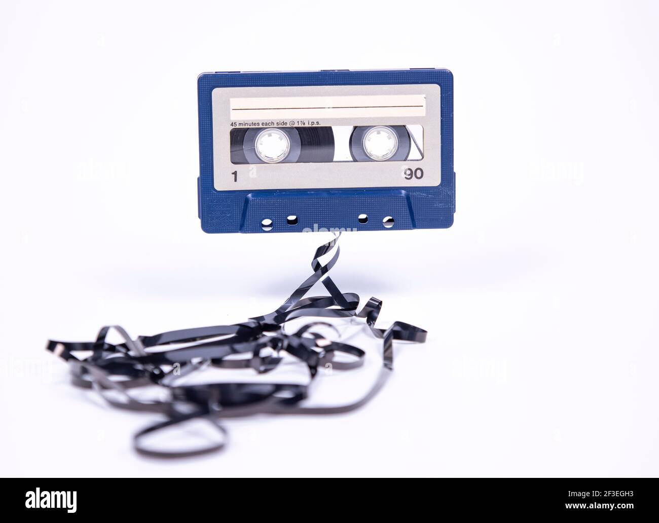 Cassette with tape spilling out Stock Photo - Alamy