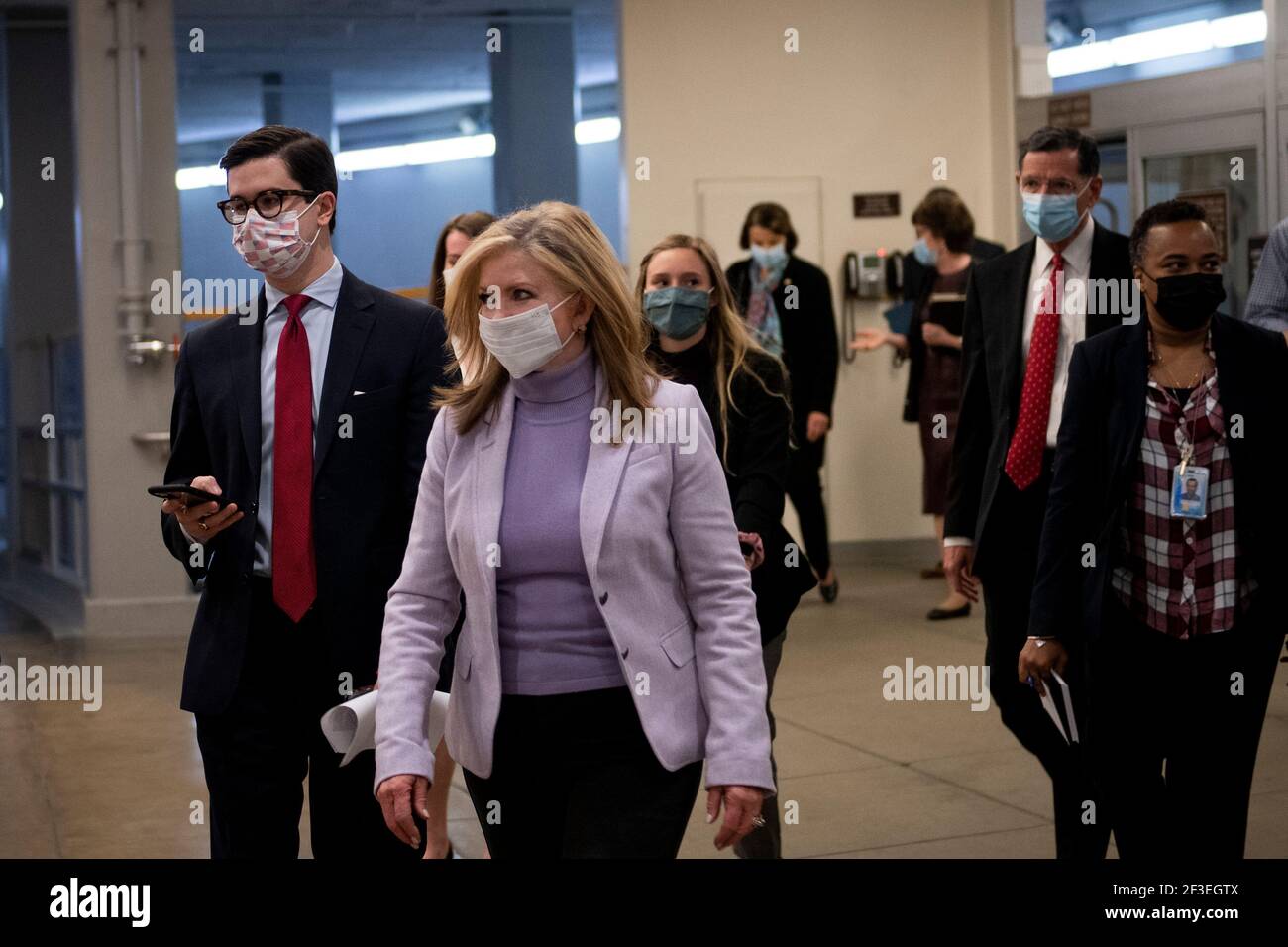 United States Senator Marsha Blackburn (Republican of Tennessee), left, and United States Senator John Barrasso (Republican of Wyoming), right, make their way through the Senate subway for a vote at the U.S. Capitol in Washington, DC, Tuesday, March 16, 2021. Credit: Rod Lamkey/CNP | usage worldwide Stock Photo