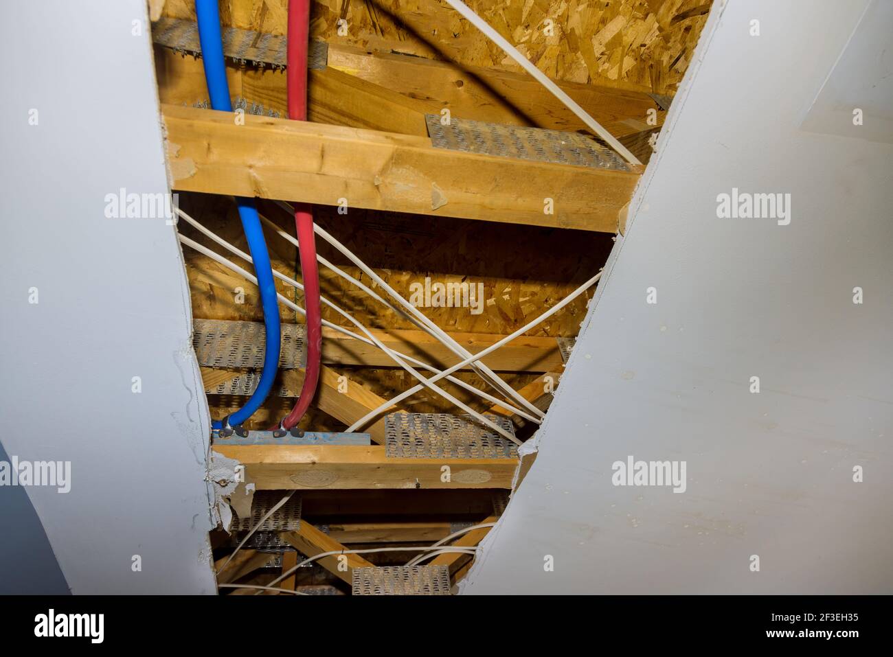 Repair of plastic polypropylene water pipes in hole ceiling in home