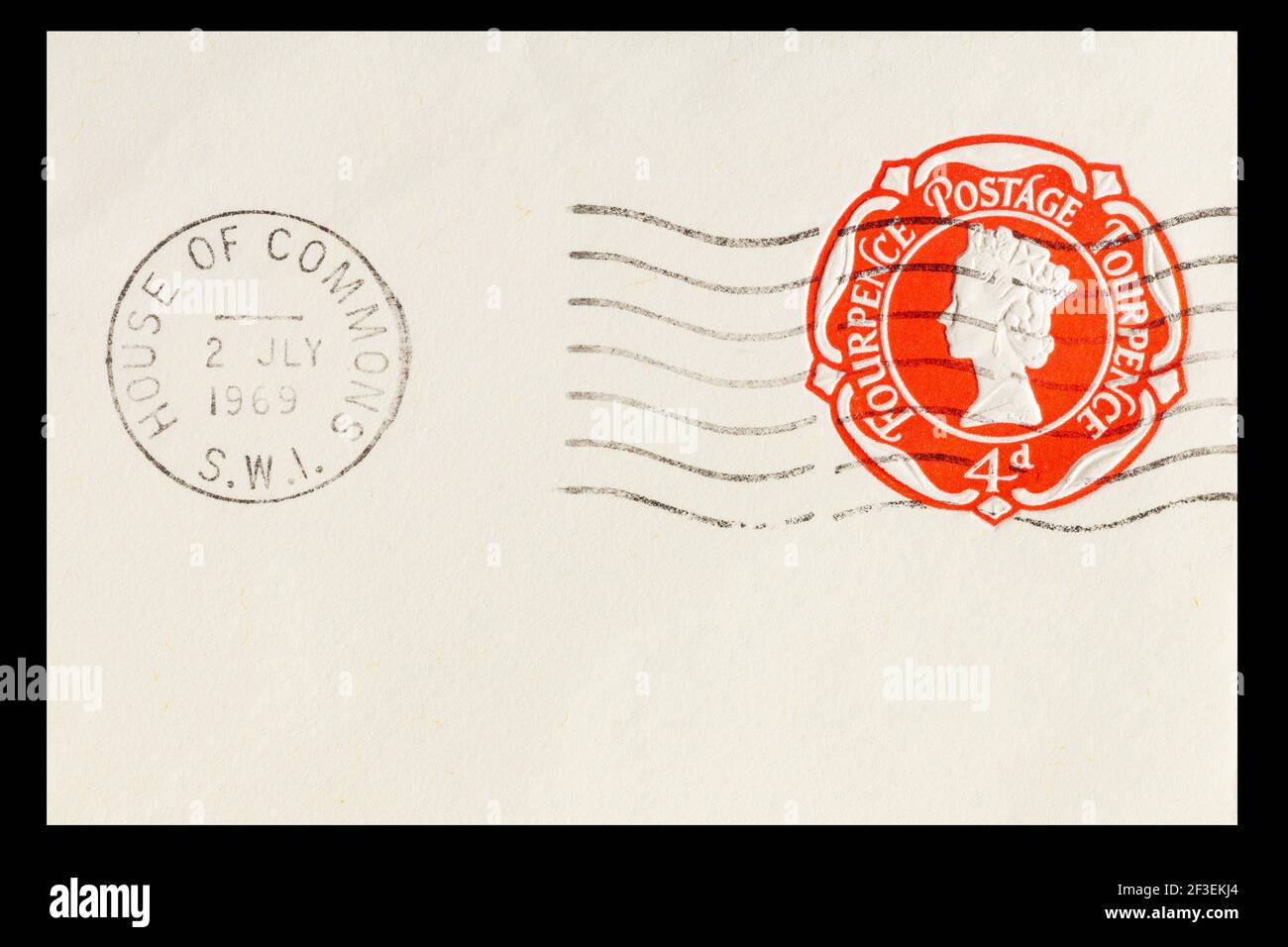 Vintage cancelled prepaid 4d postage stamp from Great Britain. Dated 2nd July 1969 and posted in the House of Commons. Clear red print in fine detail Stock Photo