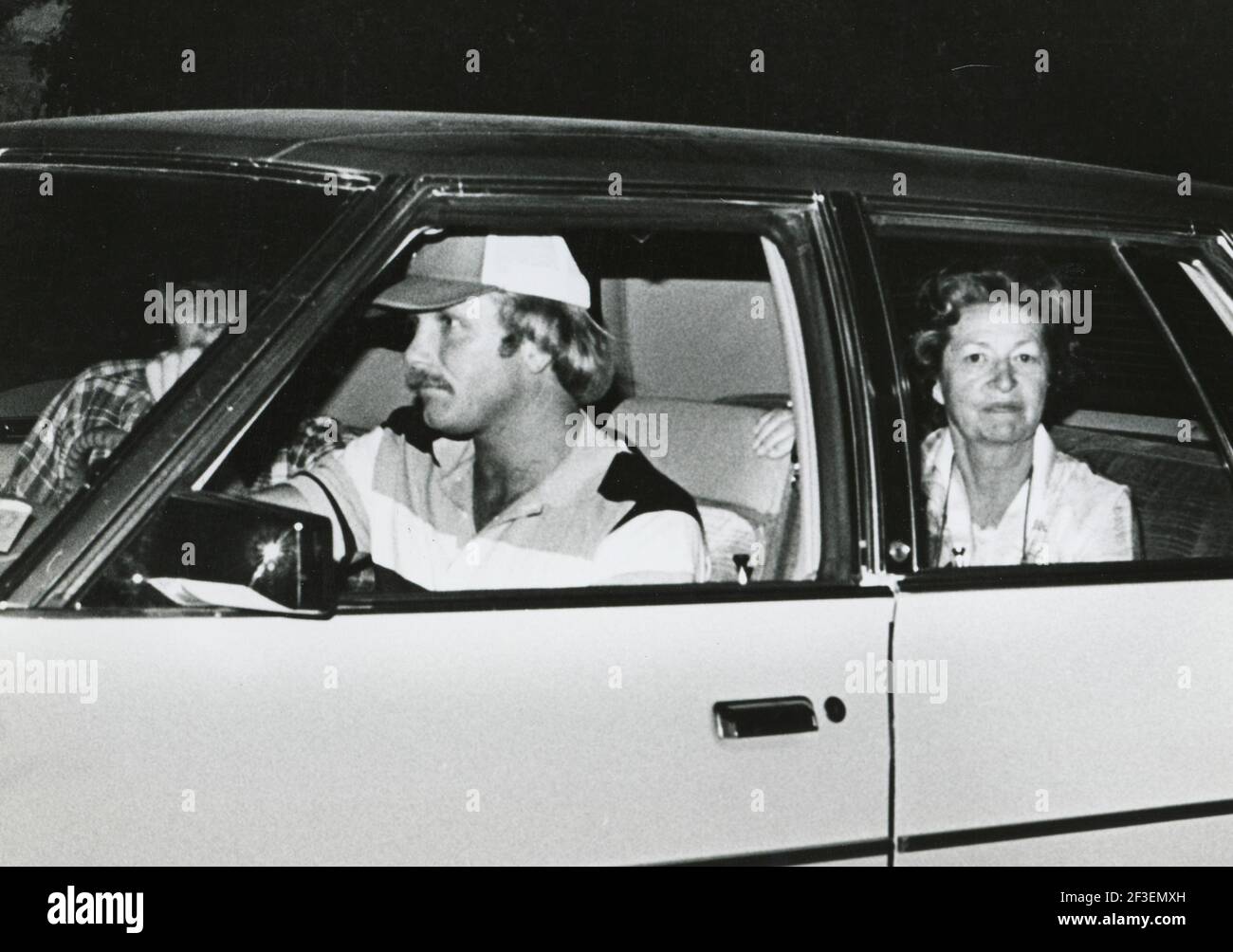 Retrospective on the life of former First Lady, Lady Bird Johnson during her years in Texas after the death of former President Lyndon Baines Johnson on January 22, 1973.  This photo shows Lady Bird Johnson in the back seat of a Secret Service car being driven away from her apartment after a small fire at KLBJ Studios in downtown Austin in the early 1980's. ©Bob Daemmrich Stock Photo