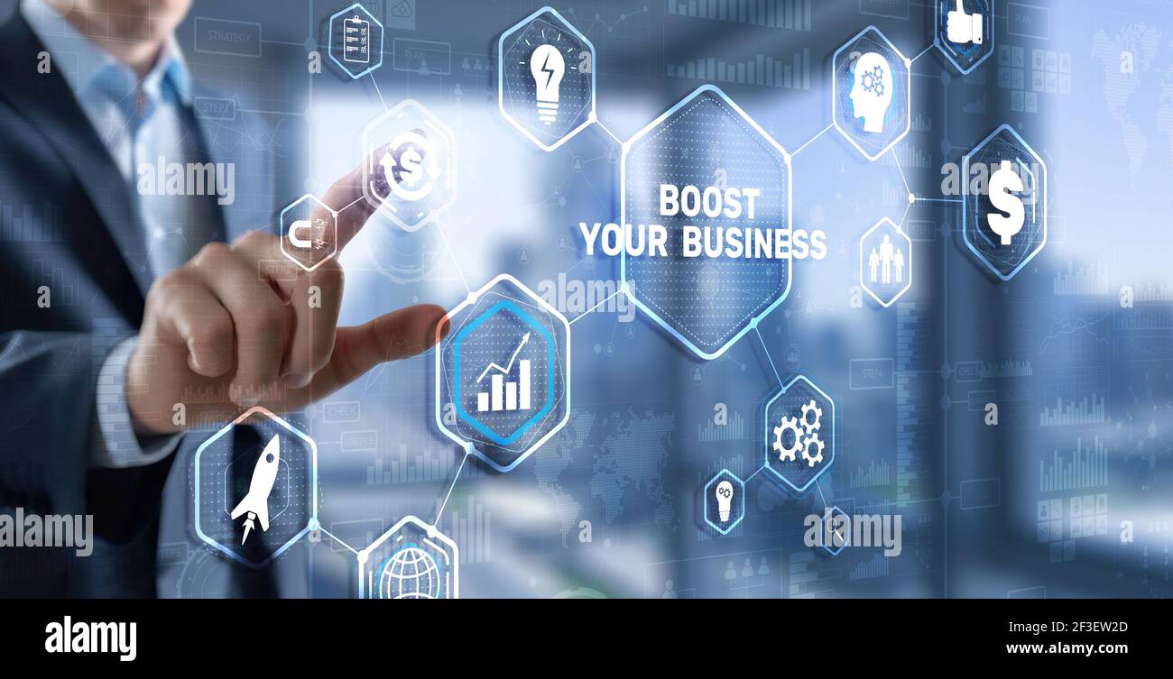 Boost Your Business 2021. Businessman touching finger virtual screen. Stock Photo