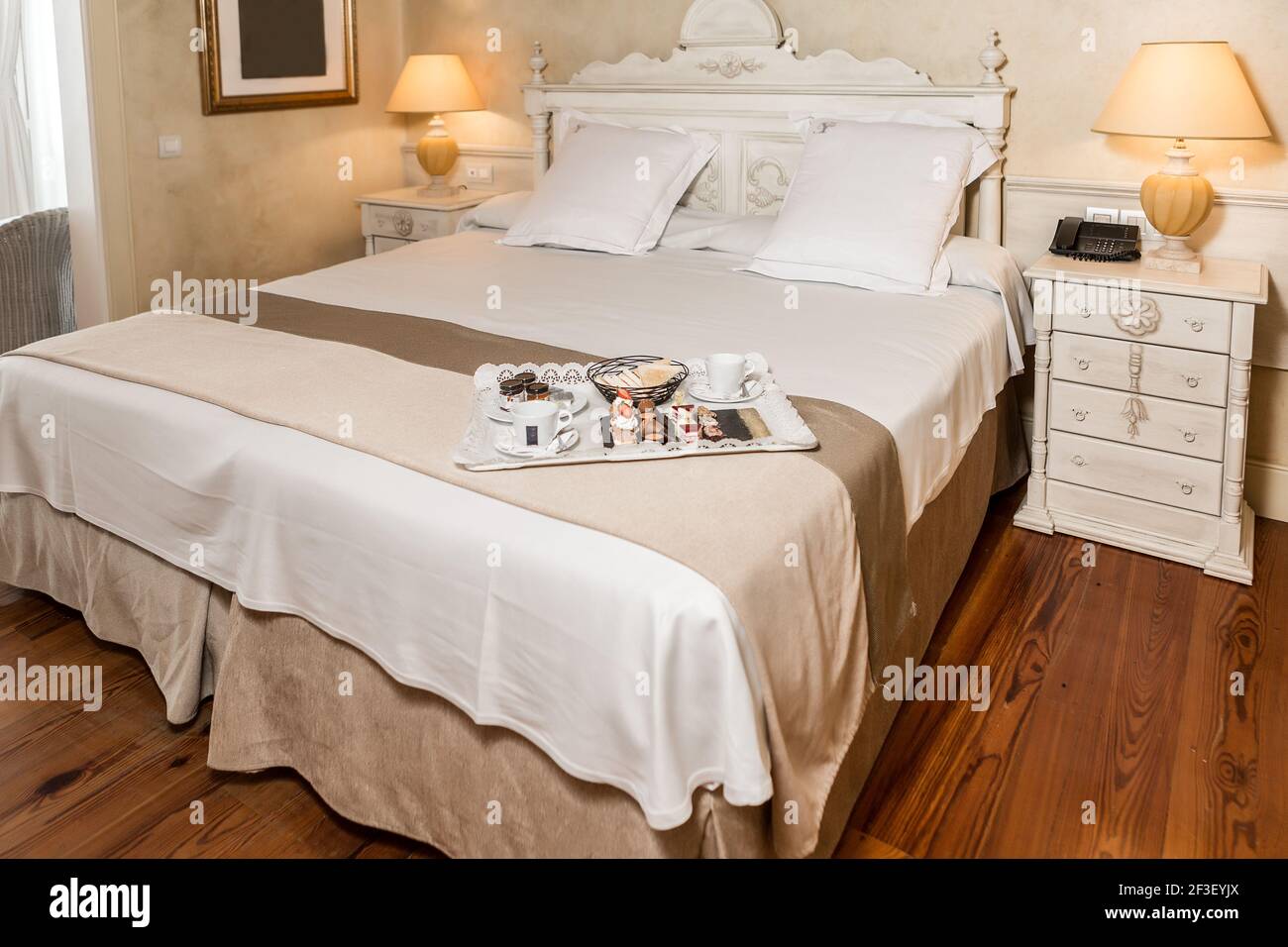 https://c8.alamy.com/comp/2F3EYJX/tray-with-assorted-sweet-food-for-breakfast-placed-on-luxury-bed-in-hotel-room-in-morning-2F3EYJX.jpg