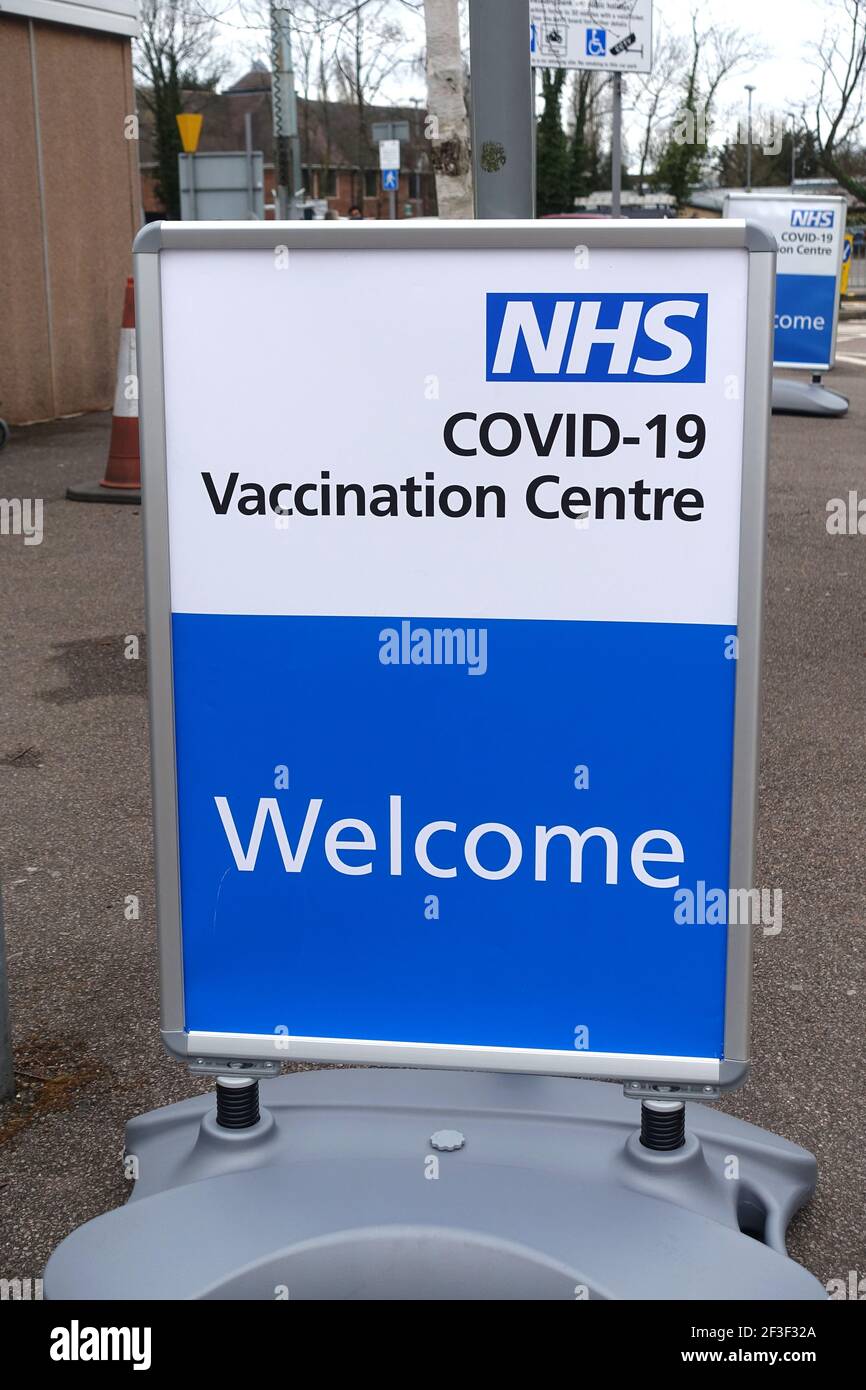 A welcome sign to an NHS Covid Vaccination Centre during the UK lockdown in 2021 Stock Photo