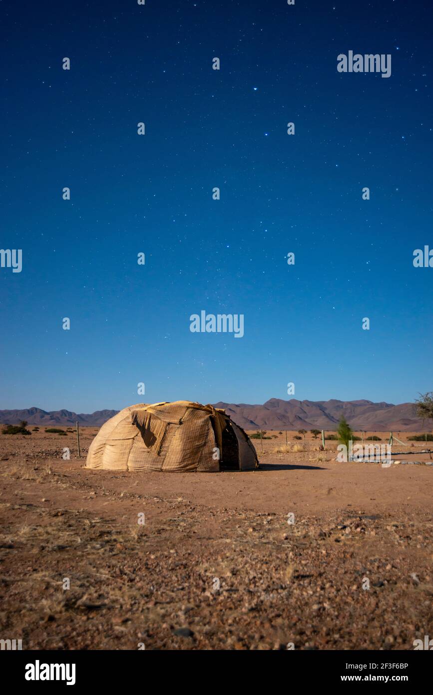 desert landscape with tradirional Nama tribe hut in Namibia by night Stock Photo