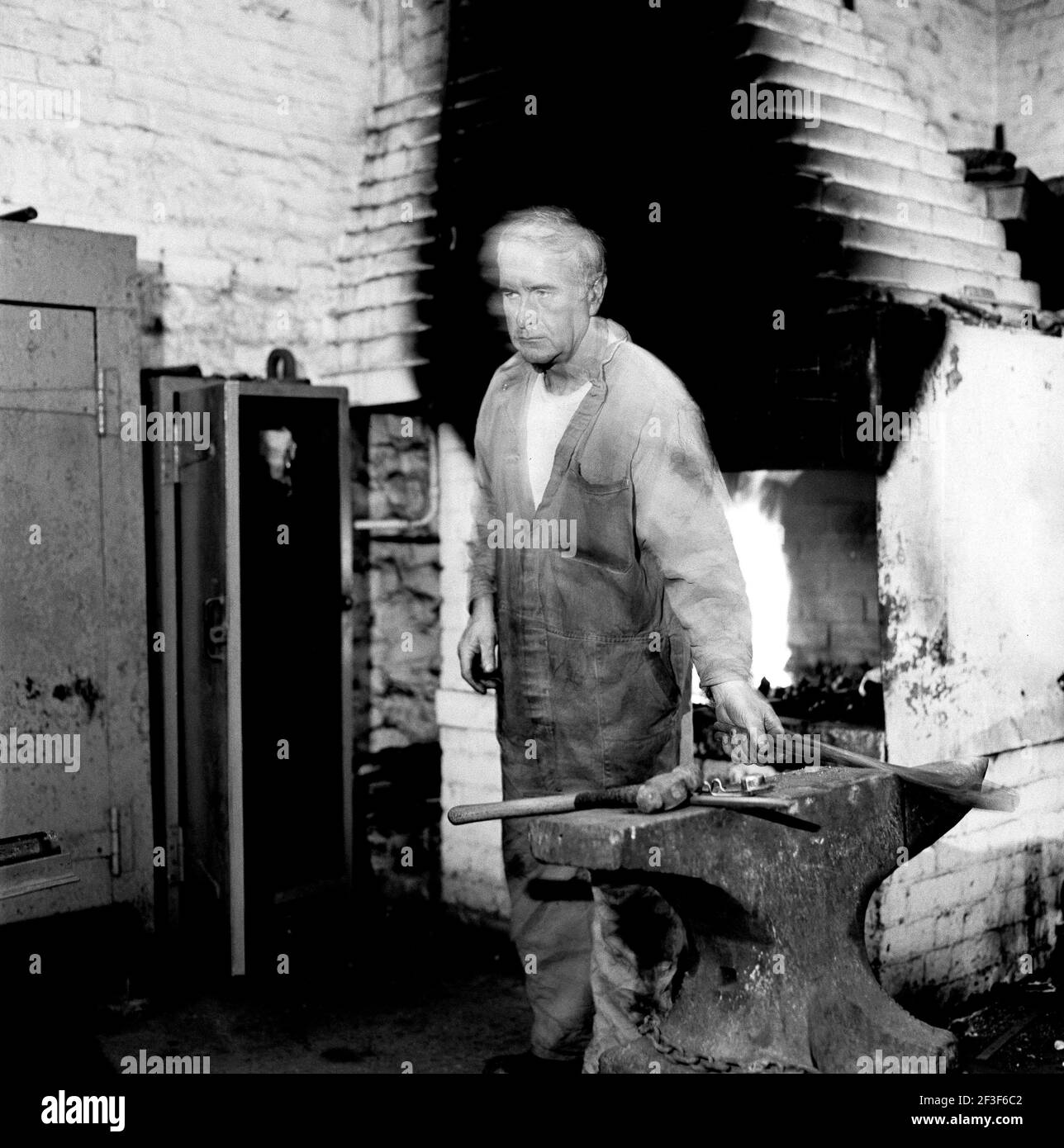 Blacksmith working at anvil  in workshop on the surface at Monkwearmouth Colliery Stock Photo