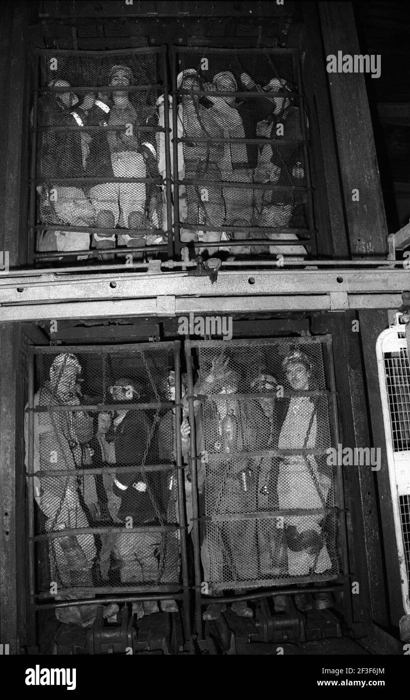 Men in lift cage before a shift underground at Monkwearmouth Colliery Stock Photo