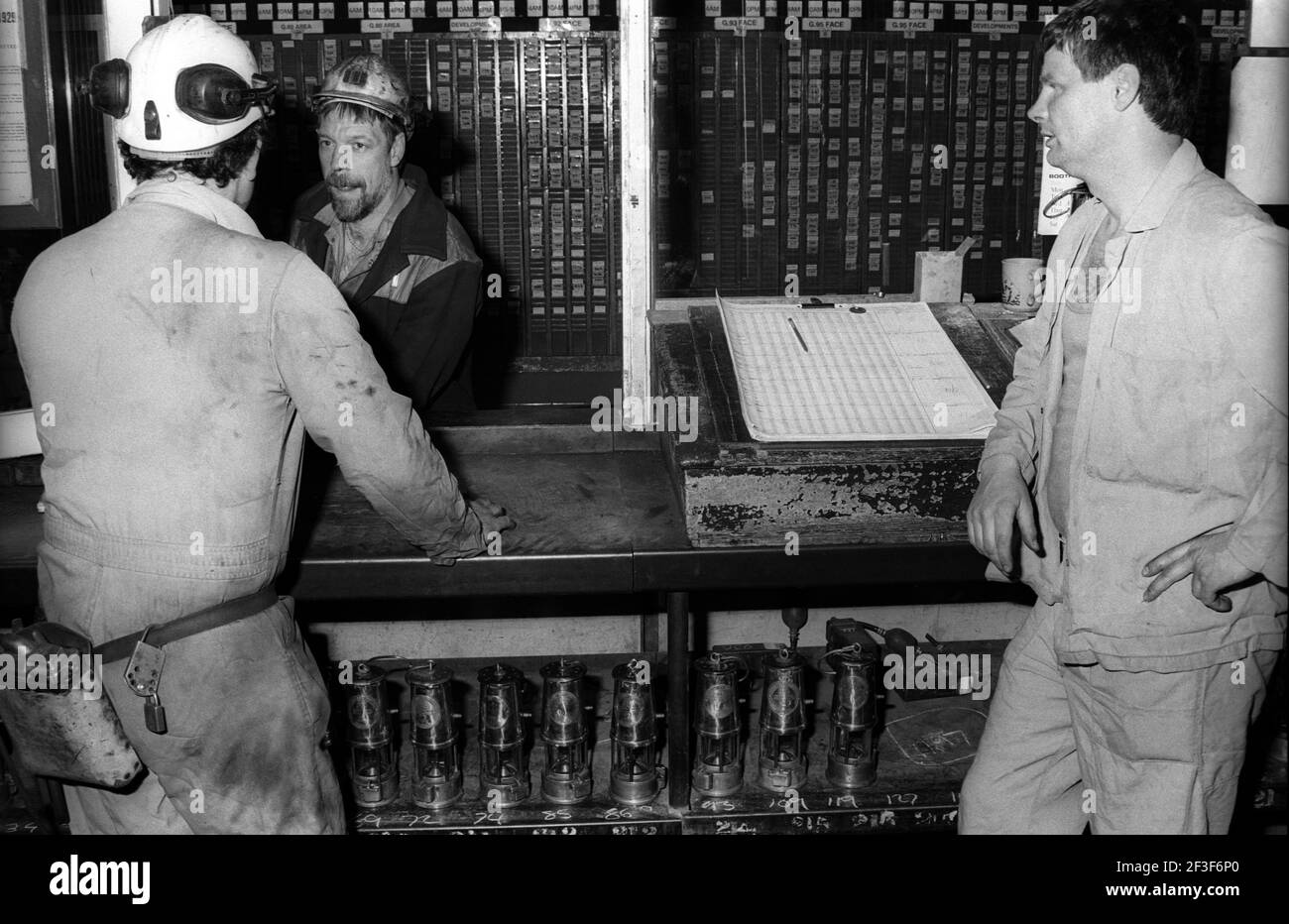 Men talking in store room on the surface at Monkwearmouth Colliery Stock Photo