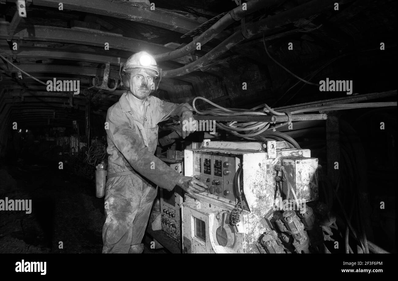 man working at the machinery on coal seam underground at Monkwearmouth Colliery Stock Photo