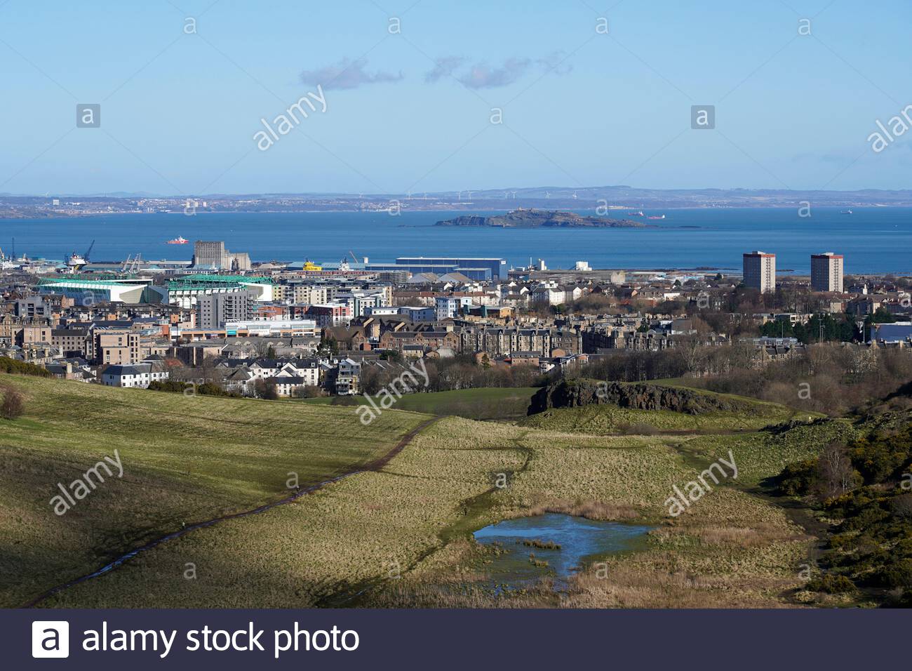 View north across Hunter's Bog from the slopes of Salisbury Crags in Holyrood Park, Edinburgh Scotland Stock Photo