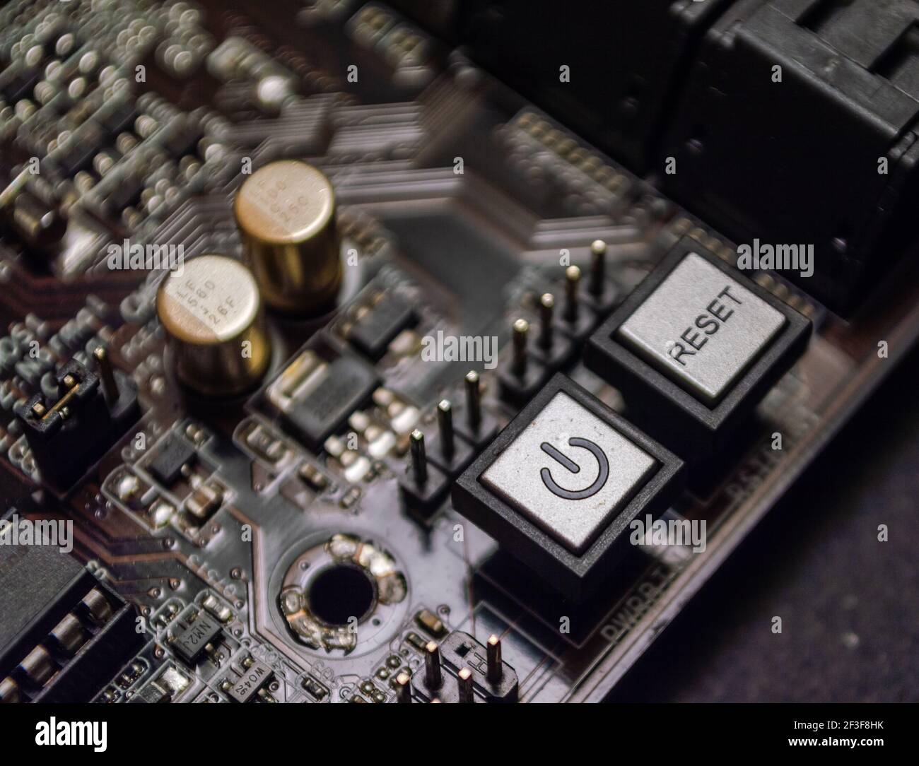 Close-up of power and reset buttons on a computer motherboard Stock ...