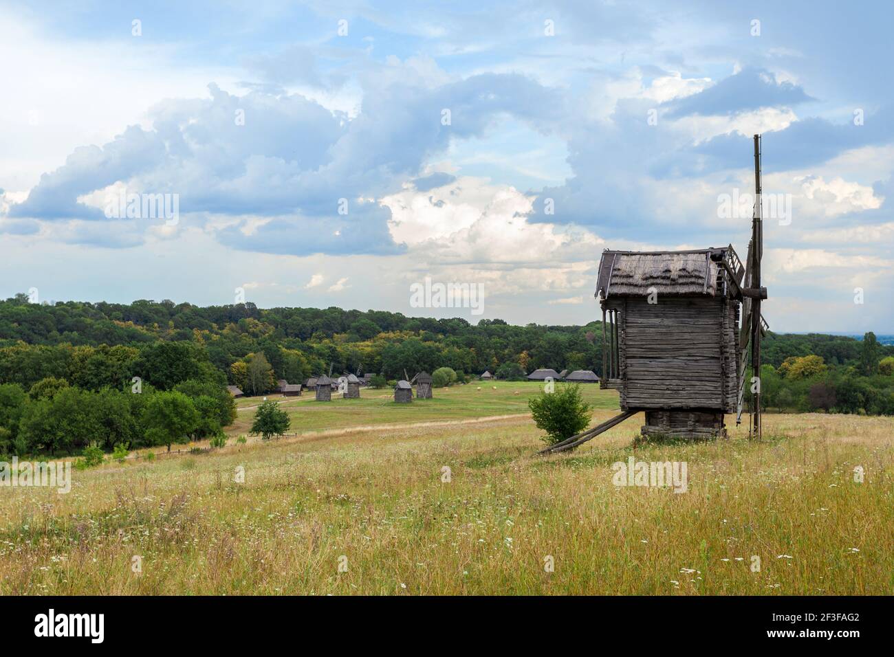 Summer landscape with an old wooden mill Stock Photo
