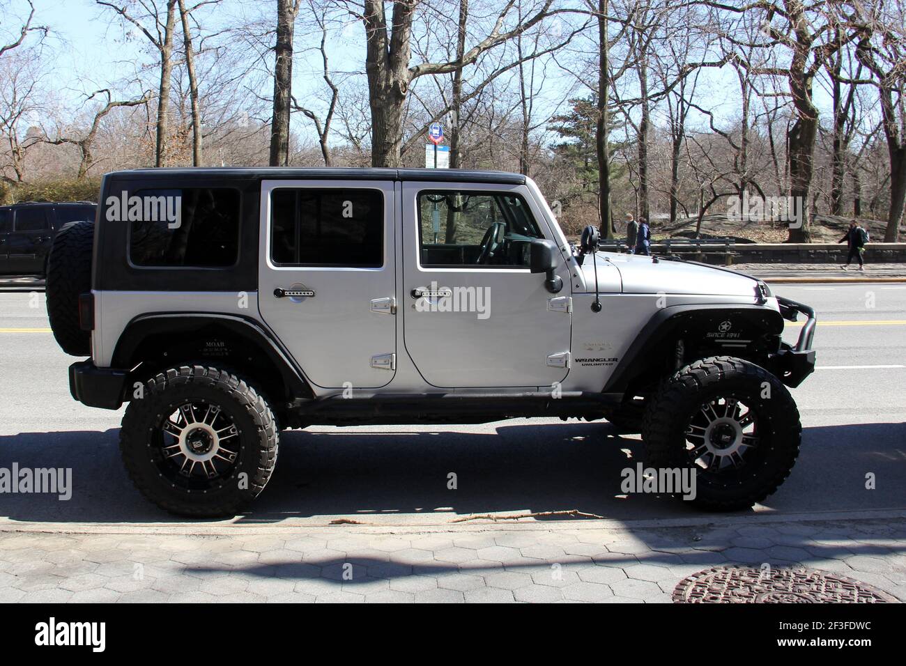 Jeep Wrangler with large wheels, parked at a curbside, side view, New York,  NY, USA Stock Photo - Alamy
