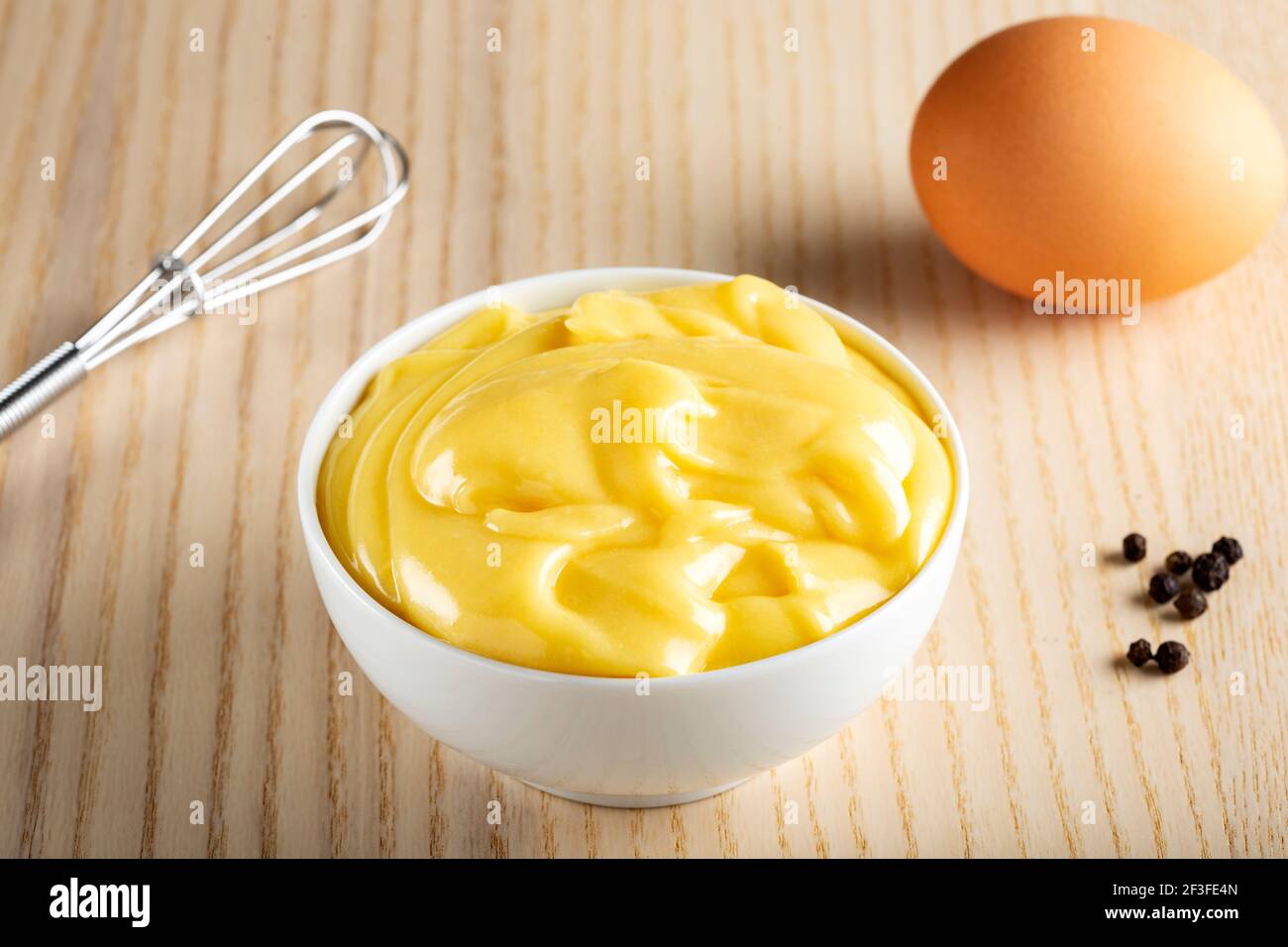 Homemade mayonnaise in a white bowl Stock Photo