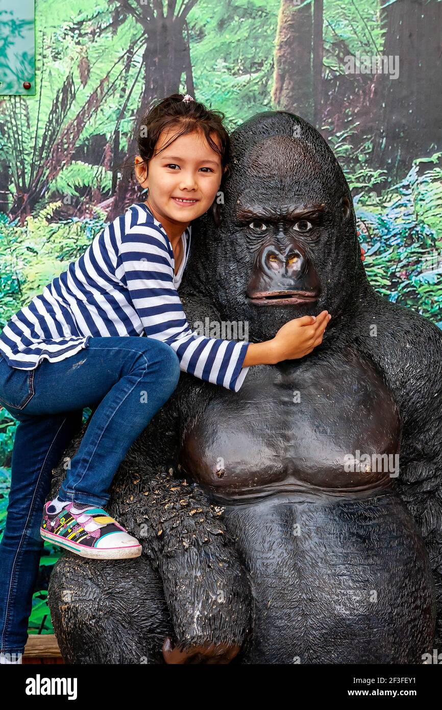Young English-Thai girl posing for photographs on a Gorilla