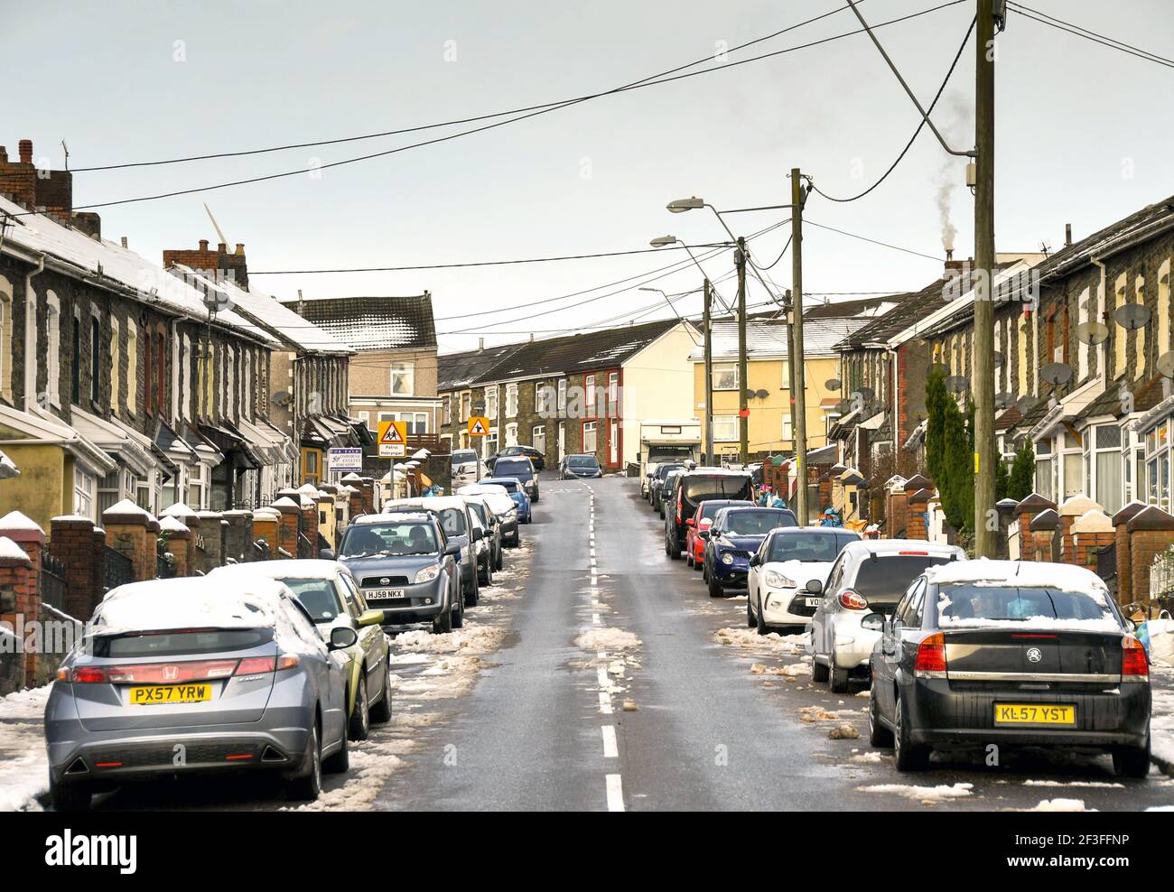 Gilfach Goch, Wales - December 2017: Street view with terraced houses and cars parked outside in a village in one of the South Wales valleys Stock Photo