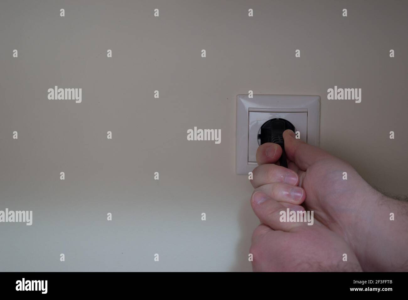 A power cord plugged into a wall power outlet hires stock photography and images Alamy