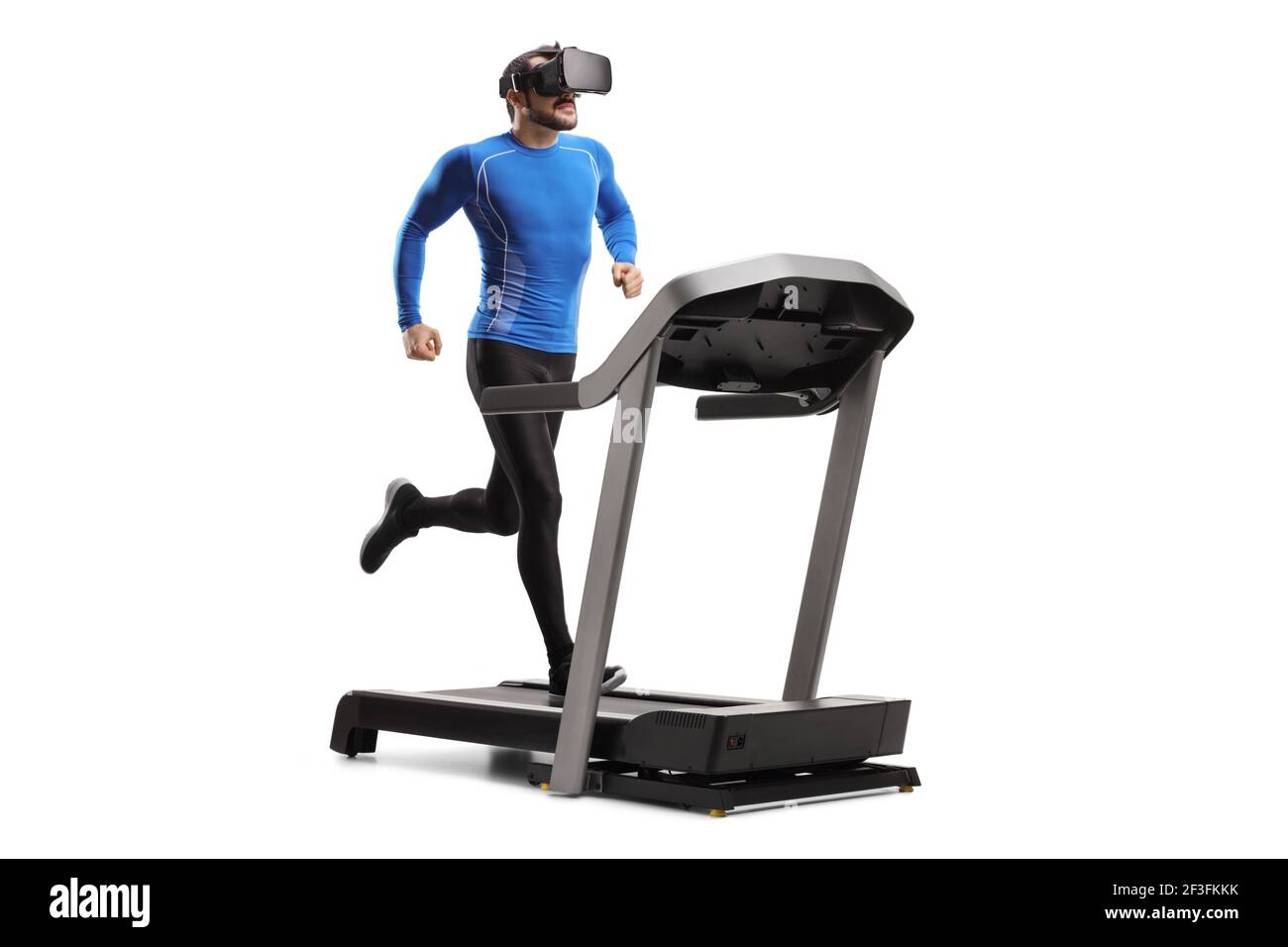 Full length shot of a fit young man in sportswear running on a treadmill  with VR headset isolated on white background Stock Photo - Alamy