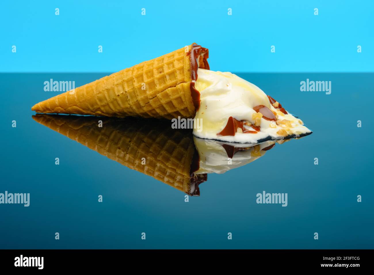 Half Melted Vanilla Flavor Ice Cream Cone On Glass With Reflection Stock Photo Alamy Half Melted Vanilla Flavor Ice Cream Cone On Glass With Reflection Stock Photo Alamy