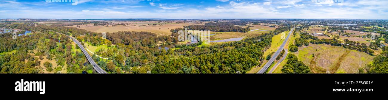 Wide aerial panorama of A440 highway and scenic countryside near town of Sale in Victoria, Australia Stock Photo