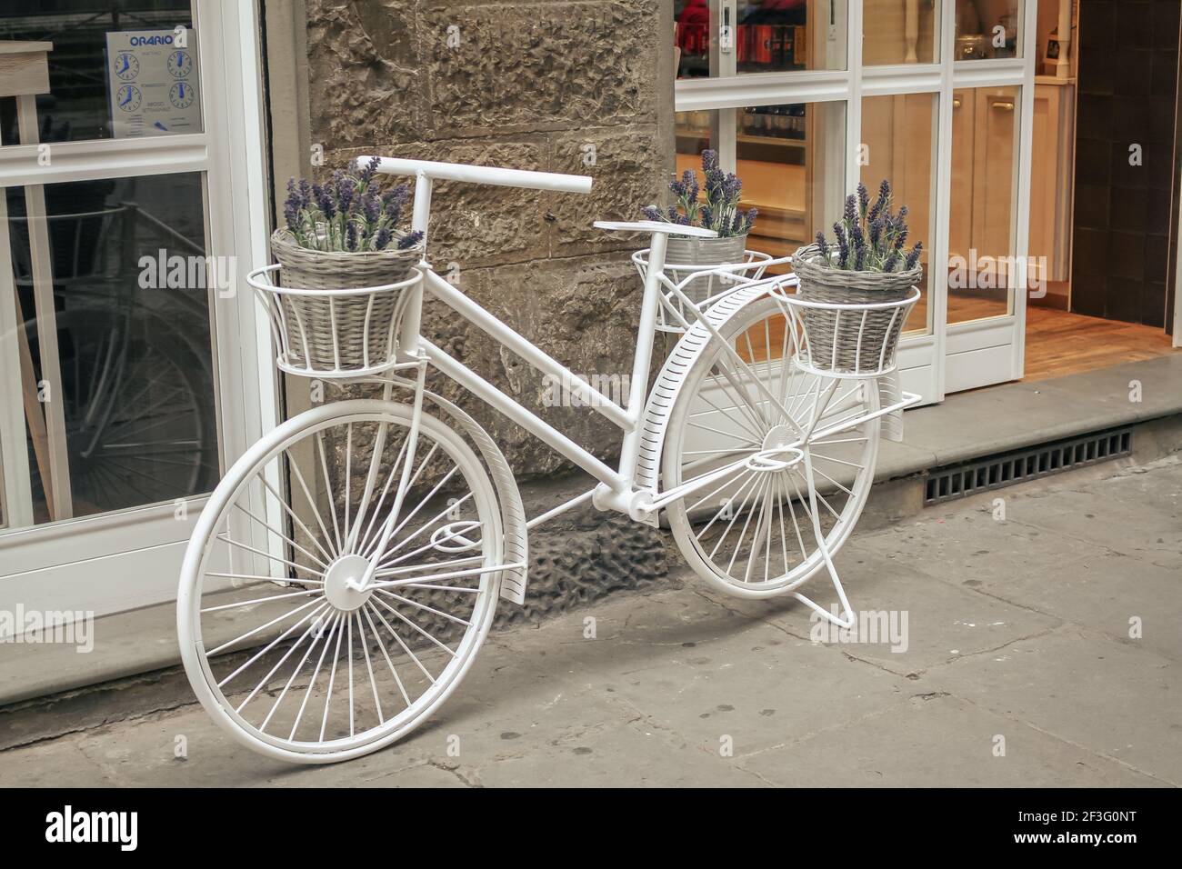 White bicycle ornament on a street in Florence. Stock Photo