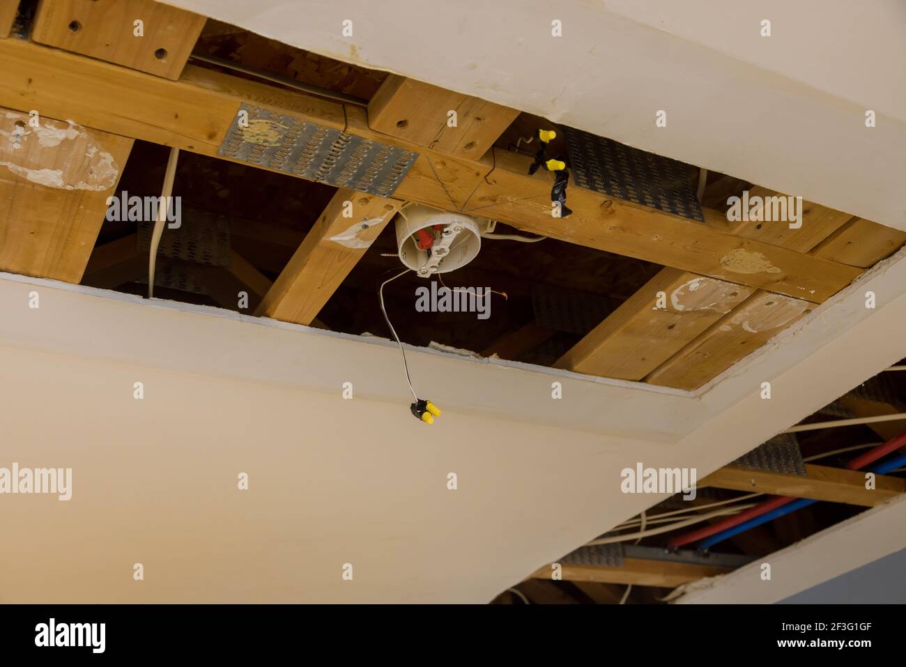 Repair plumbing line with a leaking pipe in a ceiling Stock Photo Alamy