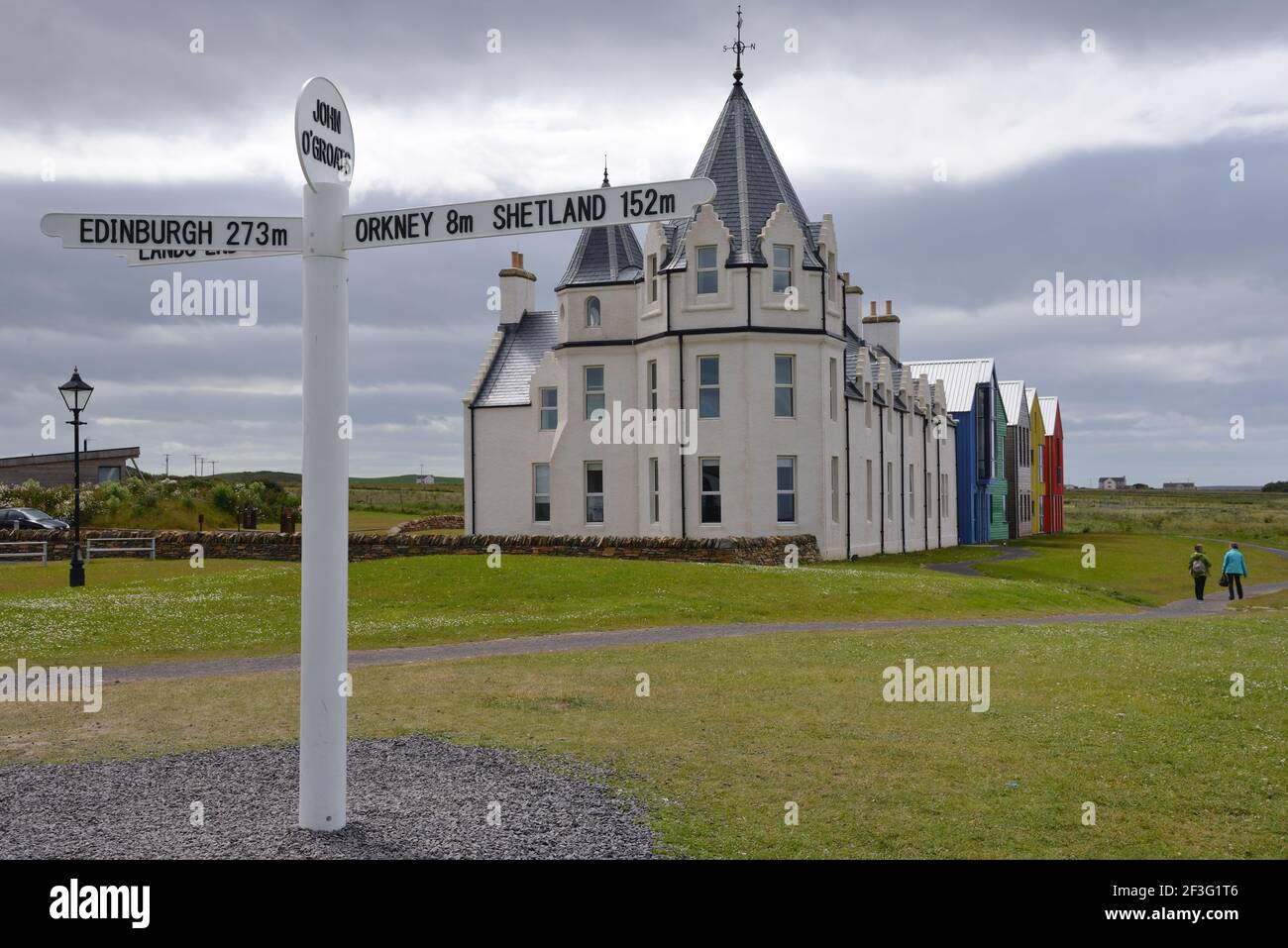 The famous landmark signpost and 5 star 'Together Travel' hotel in John o' Groats, Highland, Scotland, UK Stock Photo