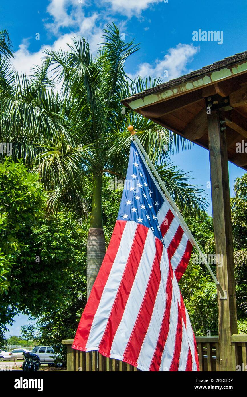 An American Flag Flying On The Entrance Building To The Miami Dade