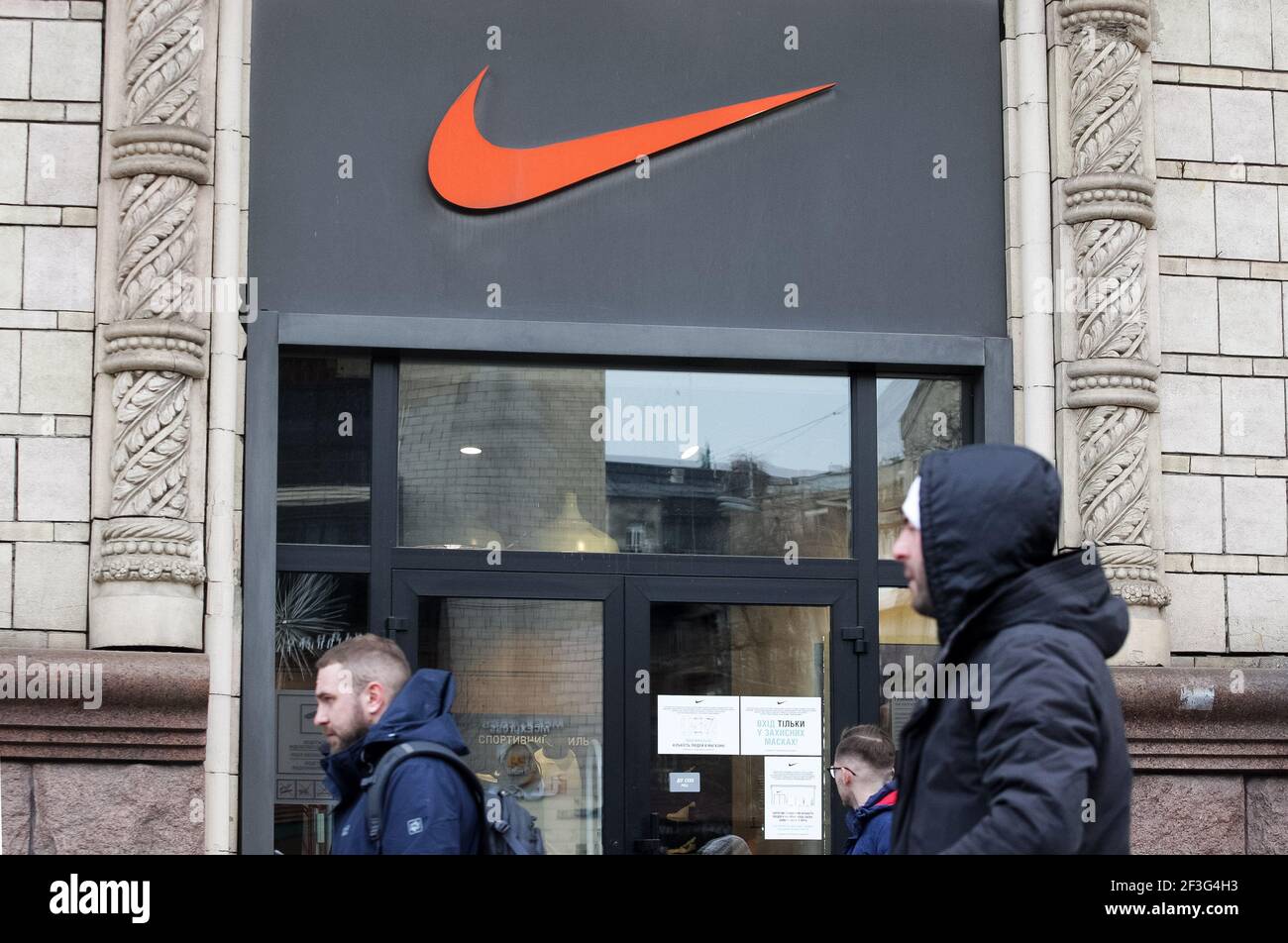 Kiev, Ukraine. 06th Mar, 2021. People walk past a Nike brand store in Kiev.  (Photo by Pavlo Gonchar/SOPA Images/Sipa USA) Credit: Sipa USA/Alamy Live  News Stock Photo - Alamy