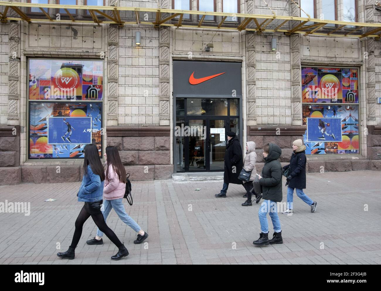 Kiev, Ukraine. 06th Mar, 2021. People walk past a Nike brand store in Kiev.  (Photo by Pavlo Gonchar/SOPA Images/Sipa USA) Credit: Sipa USA/Alamy Live  News Stock Photo - Alamy