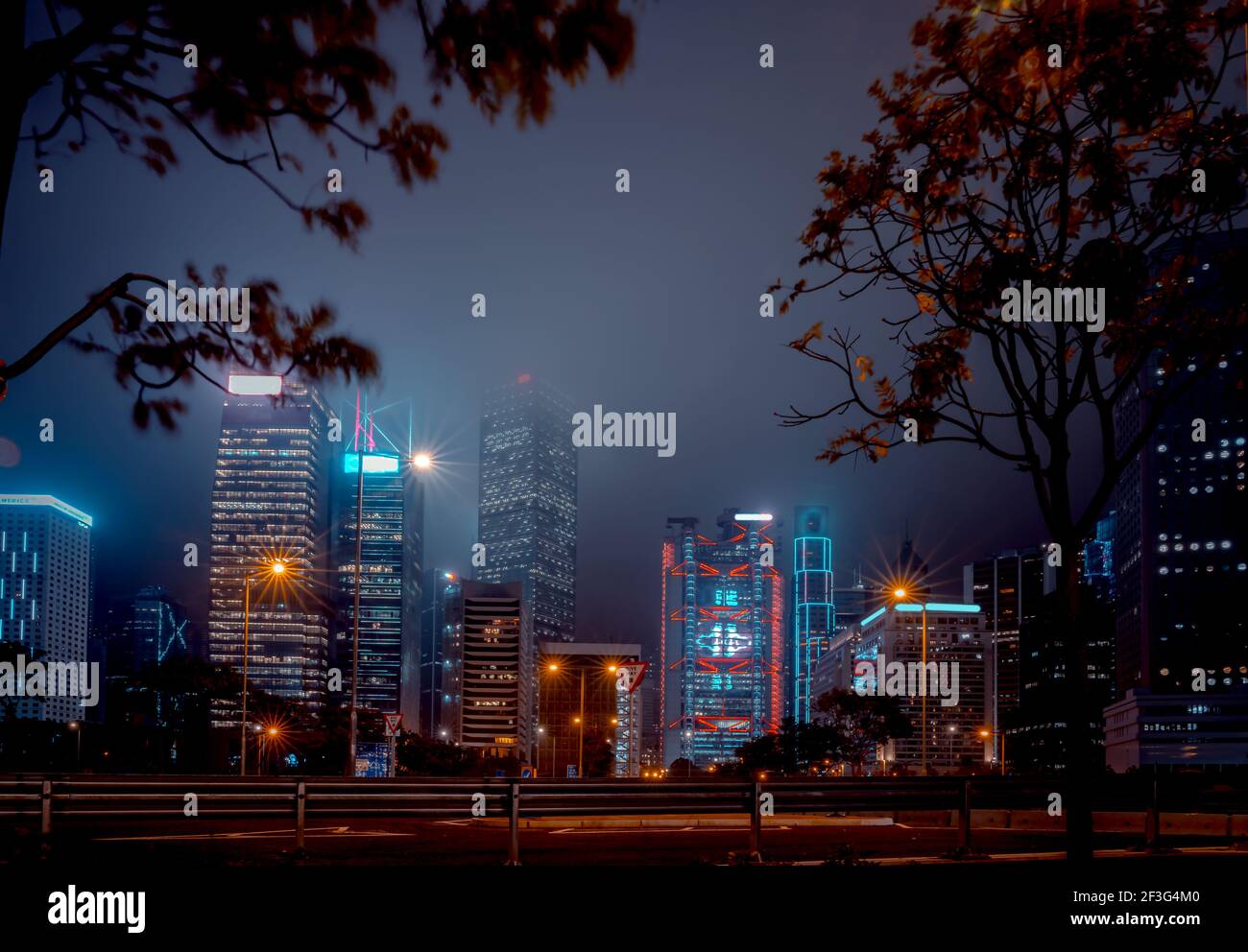 Modern office buildings in Hong Kong at foggy night Stock Photo - Alamy