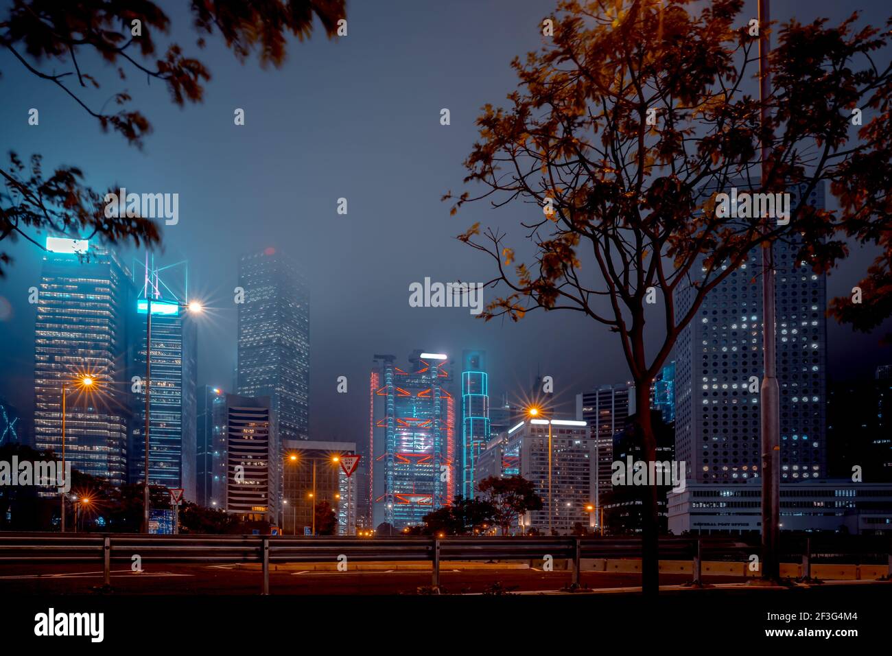 Modern office buildings in Hong Kong at foggy night Stock Photo - Alamy