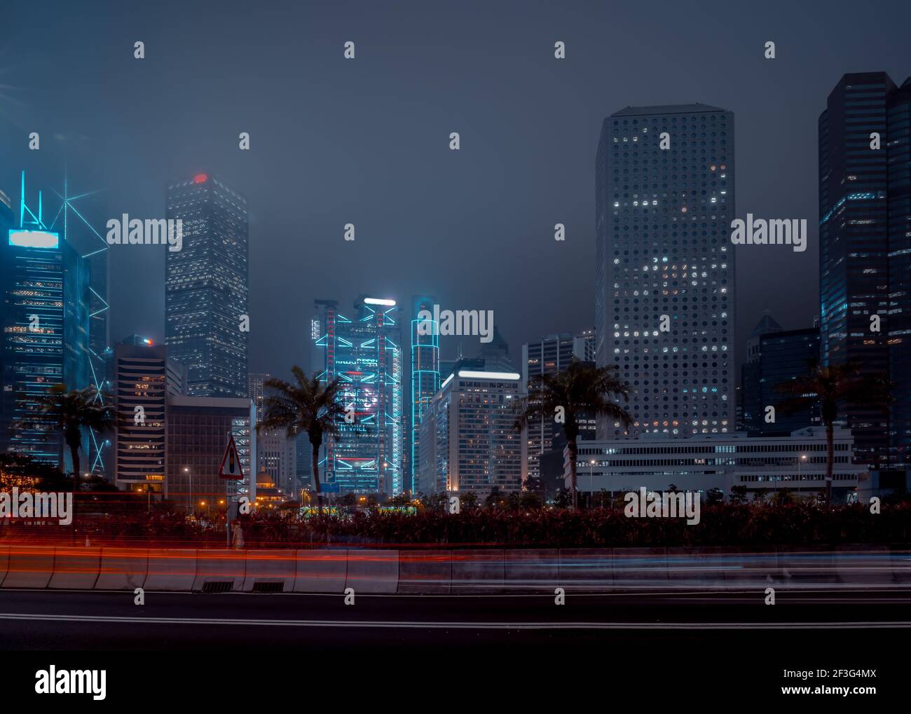 Modern office buildings in Hong Kong at foggy night Stock Photo - Alamy
