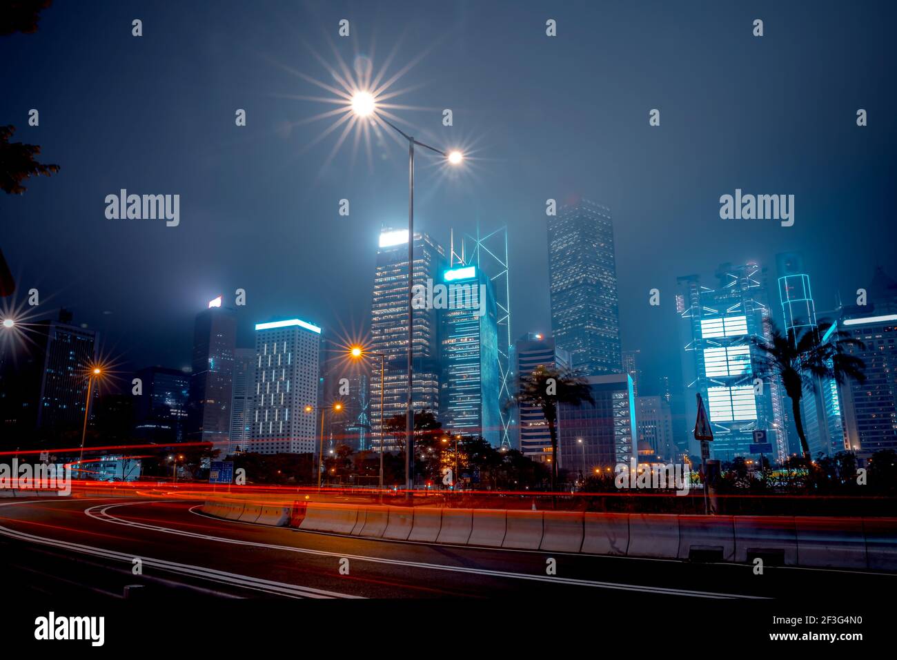 Modern office buildings in Hong Kong at foggy night Stock Photo - Alamy