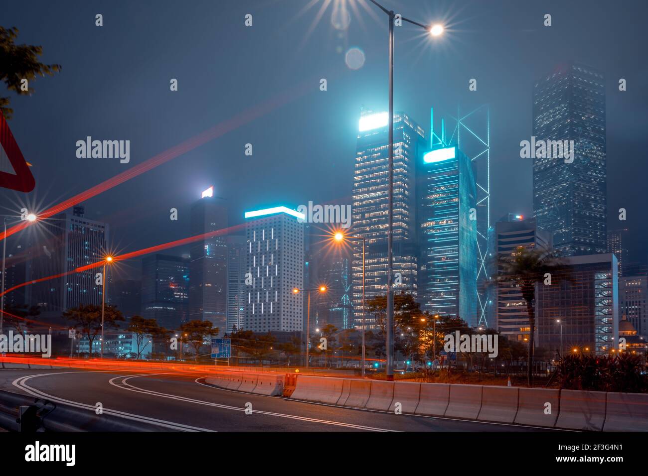 Modern office buildings in Hong Kong at foggy night Stock Photo - Alamy
