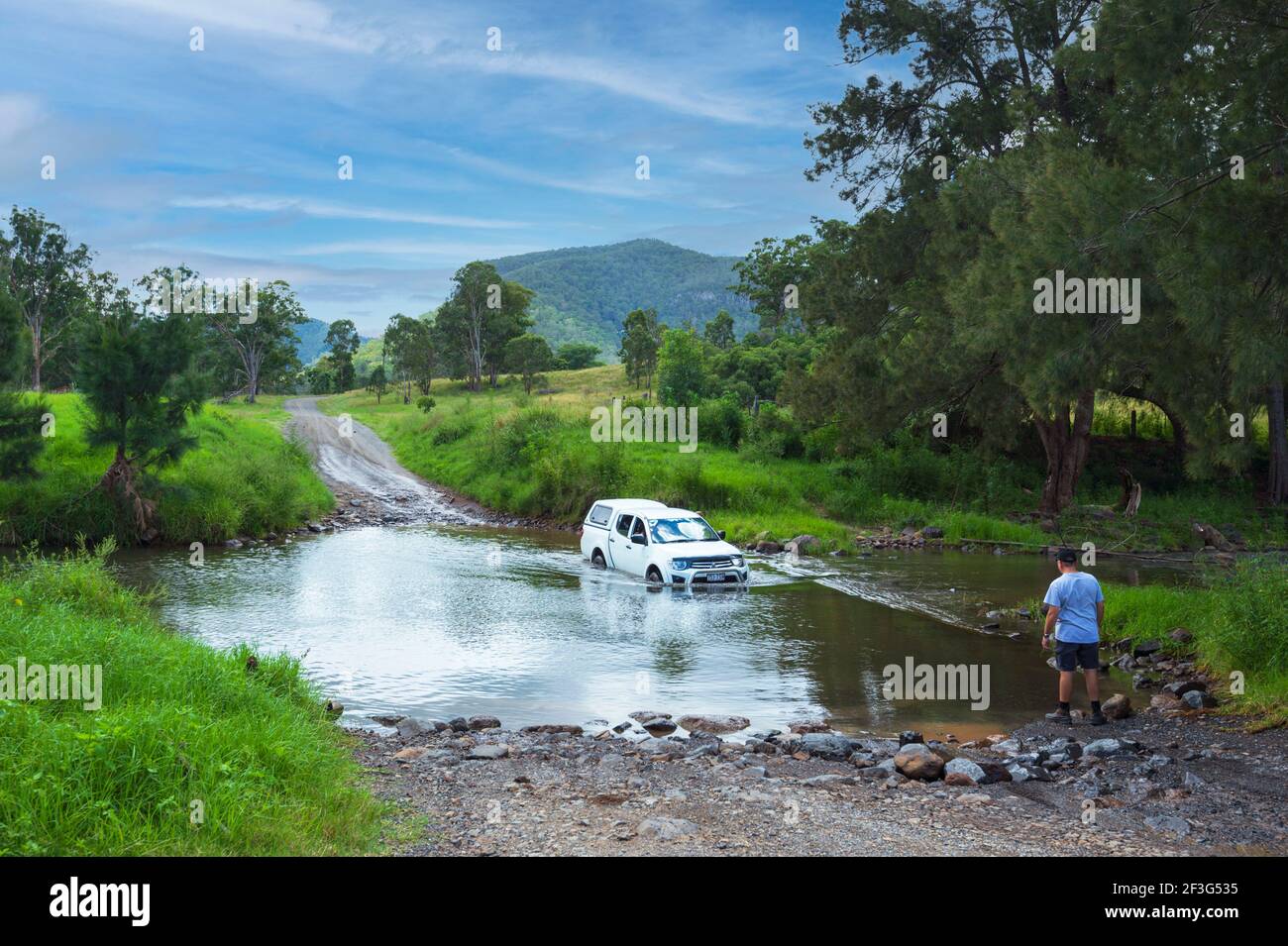 Four wheel drive vehicle crossing the Condamine River at Killarney, a popular spot for off-road driving, Queensland, QLD, Australia Stock Photo