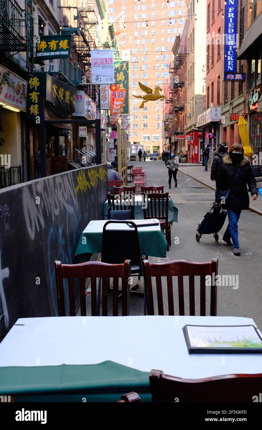Outdoor seating of a restaurant set up on Pell Street in Manhattan Chinatown during Covid19