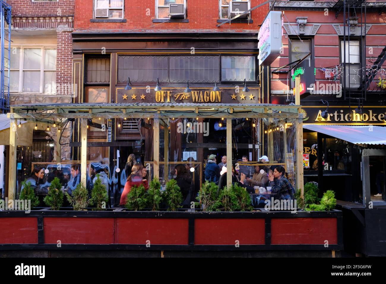 Outdoor patio opened during Covid19 pandemic of Off the Wagon bar on MacDougal Street in