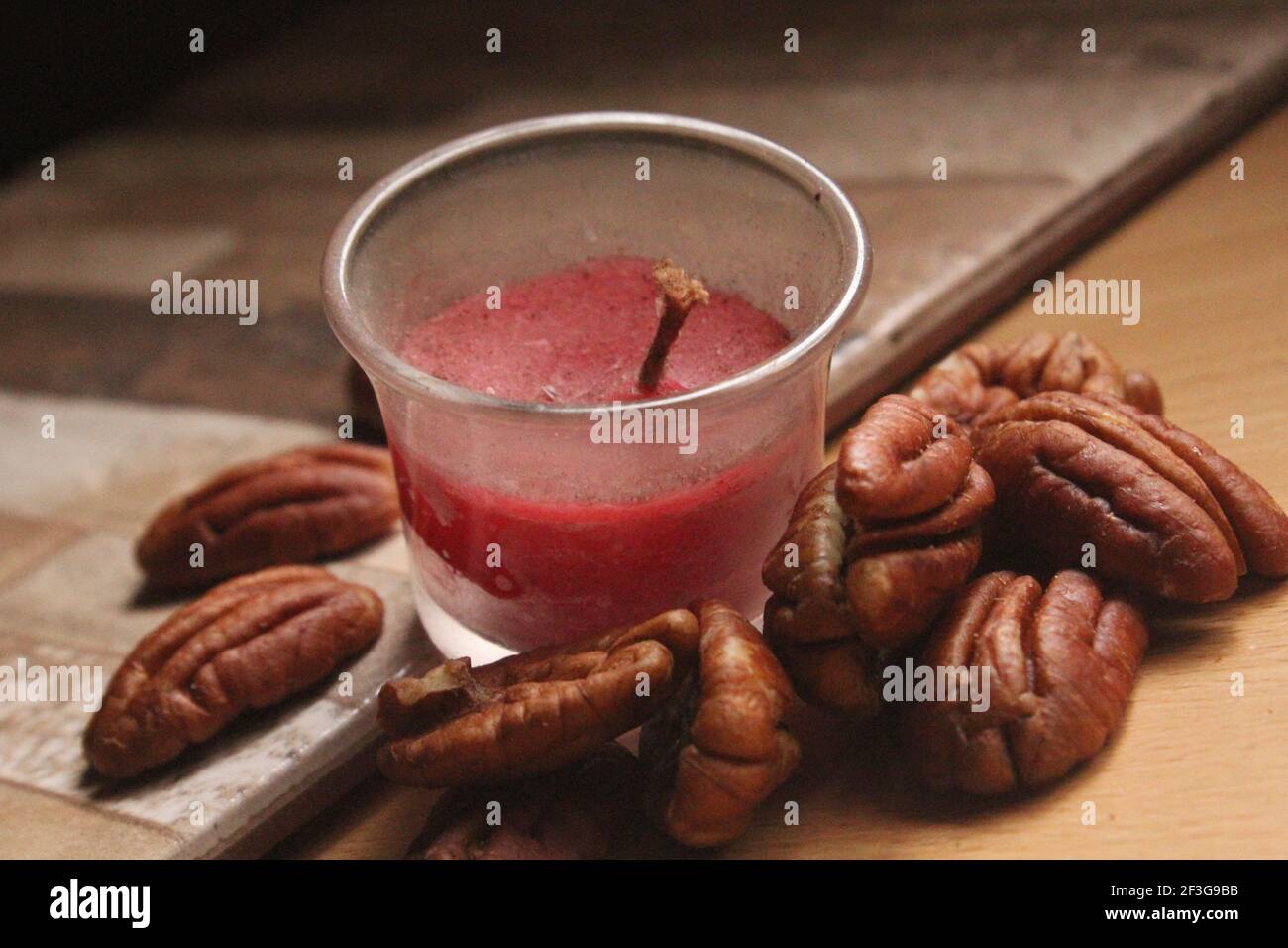 Pecan Nuts with Candle Stock Photo Alamy