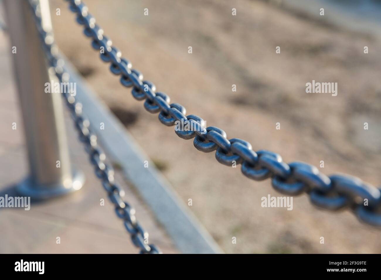 Hanging chain between two posts Stock Photo Alamy